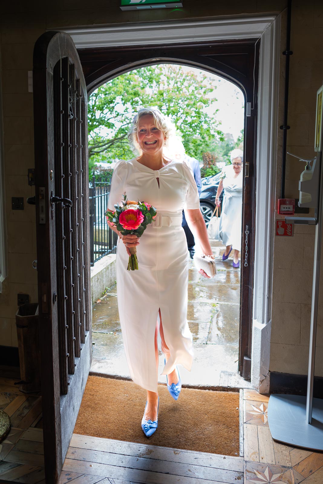 Joanne enters the front door at Lewes Register Office before her wedding to Martin.