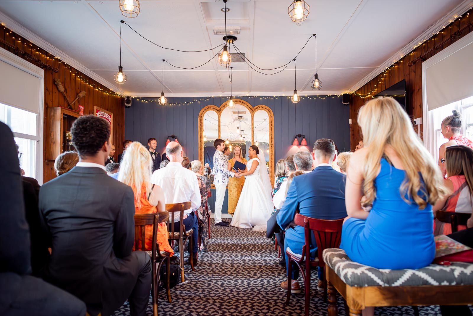 Olivia and Edward enjoy the wedding ceremony at the function room at The Royal Oak in Lewes surrounded by friends and family.