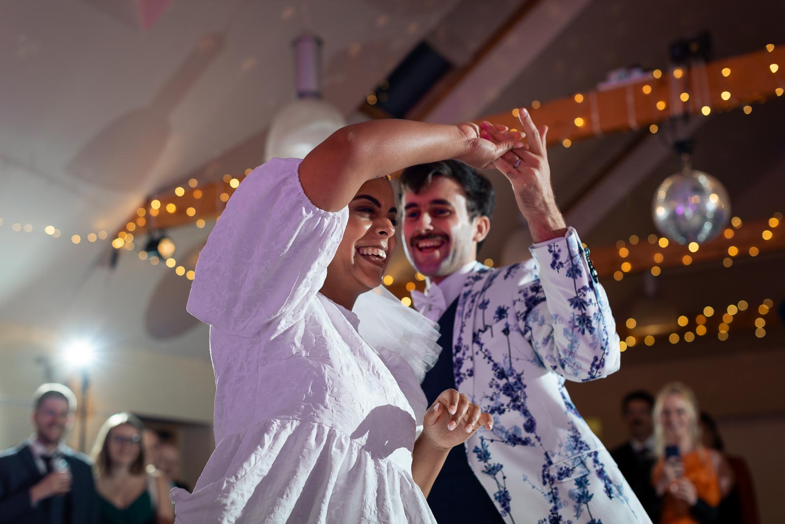 Olivia and Edward enjoy the first dance at Beechwood Hall near Lewes after getting married at Southover Grange in Lewes. 