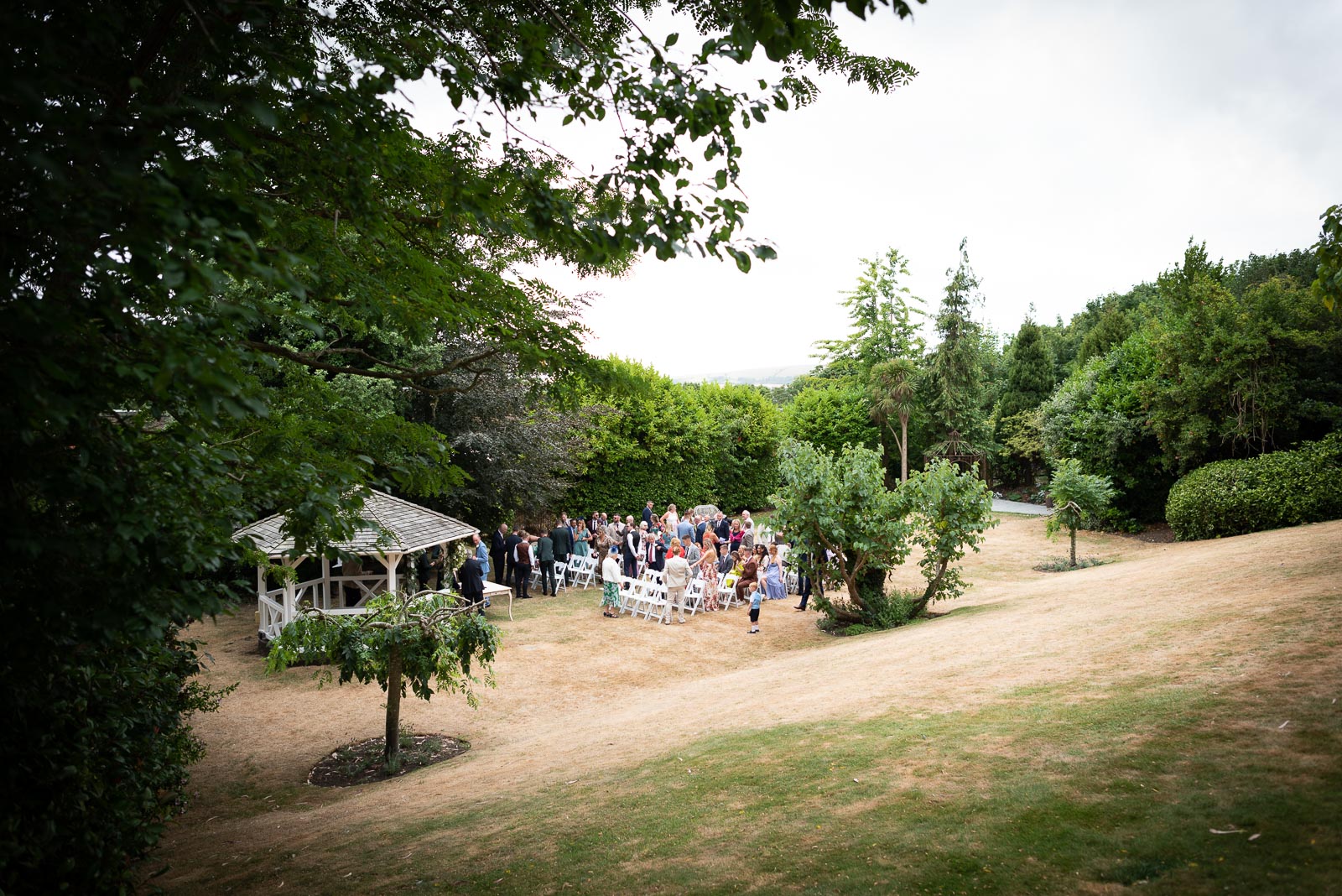 Guest start to sit at the Gazebo in the garden at Pelham House Hotel, Lewes before Natalie's wedding to Dean.