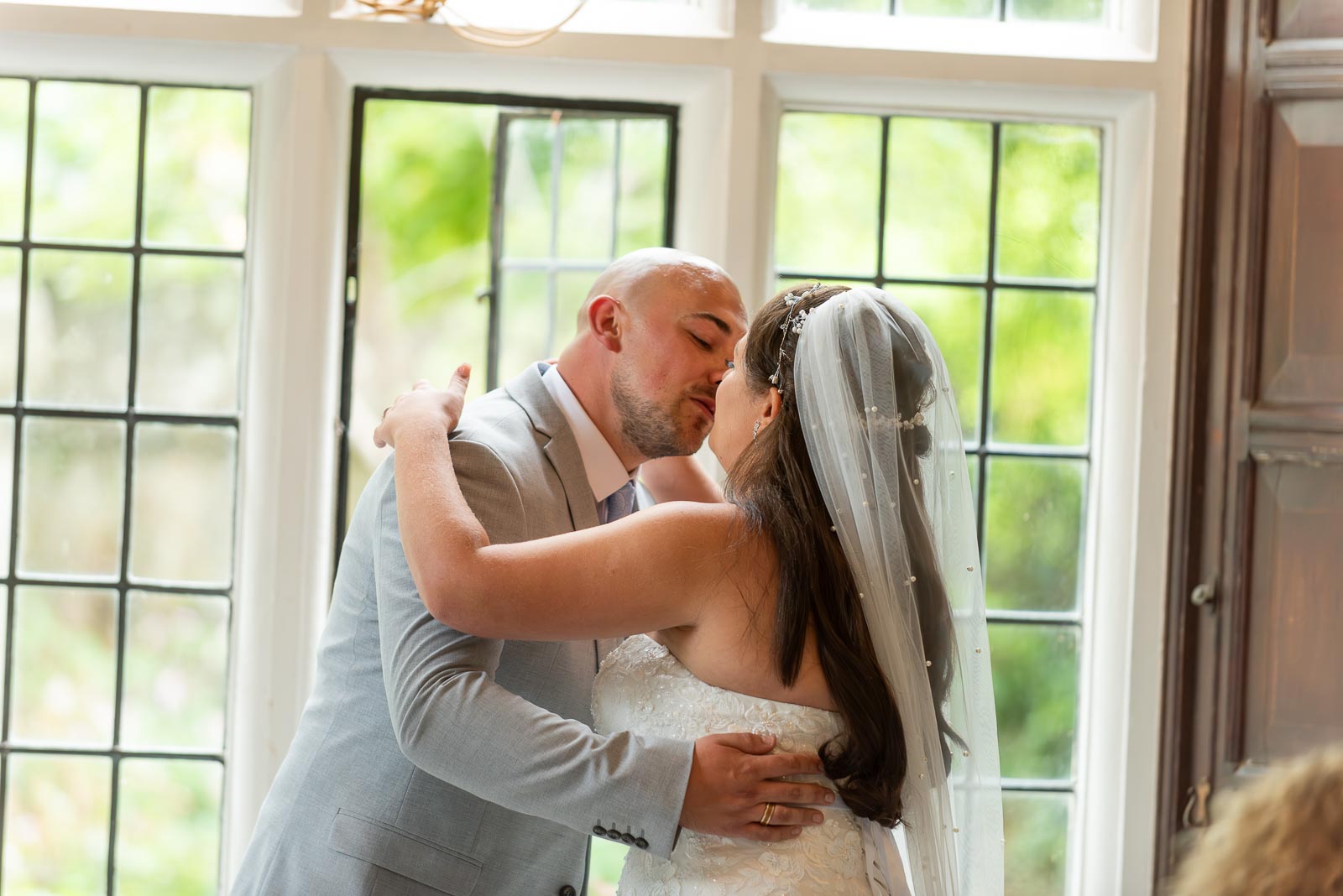 Soraya and Billy embrace after being declared husband and wife in the Ainsworth Room, Lewes Register Office.