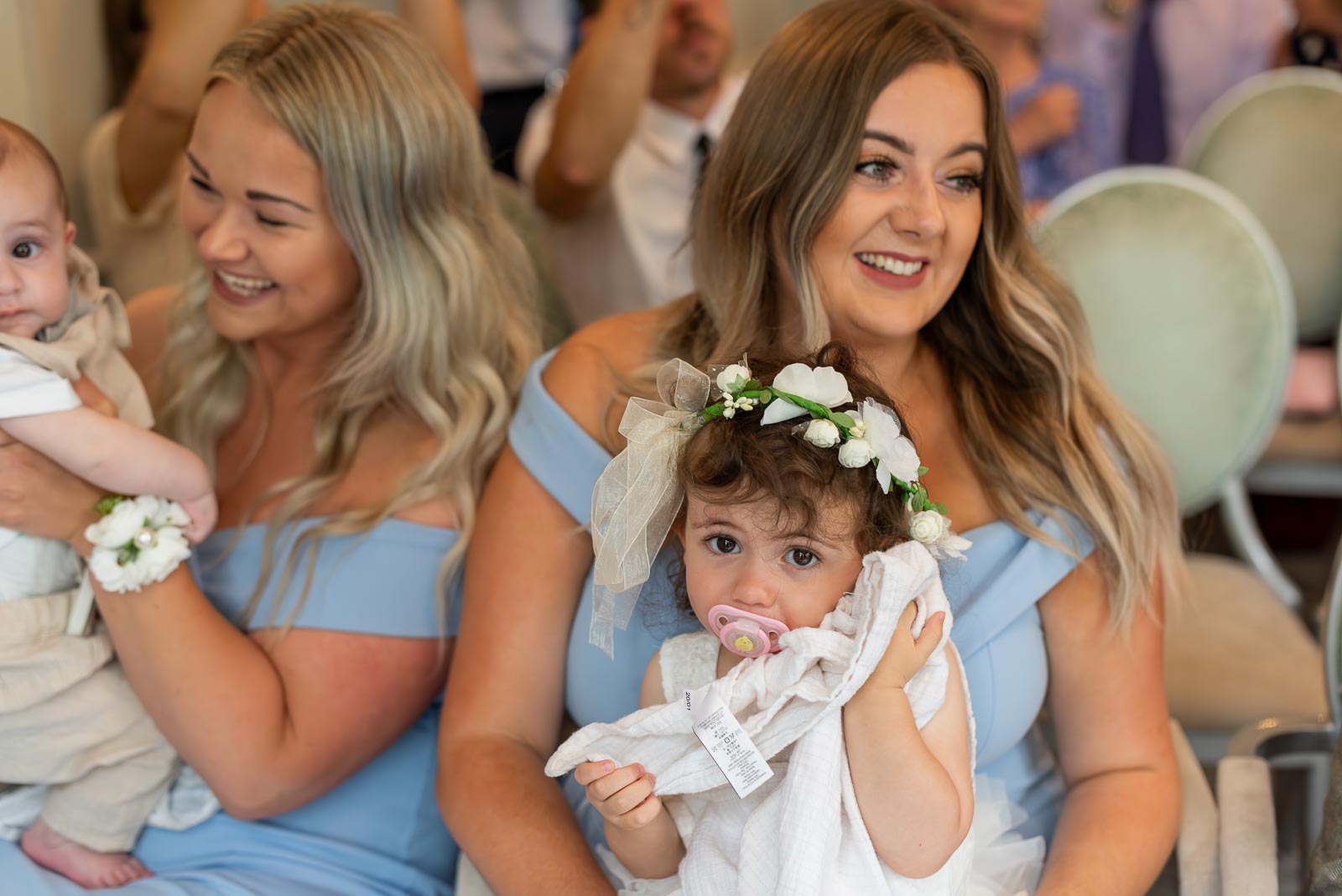 Guests enjoy a funny moment at Billy and Soraya's wedding in the Ainsworth Room, Lewes Register Office.