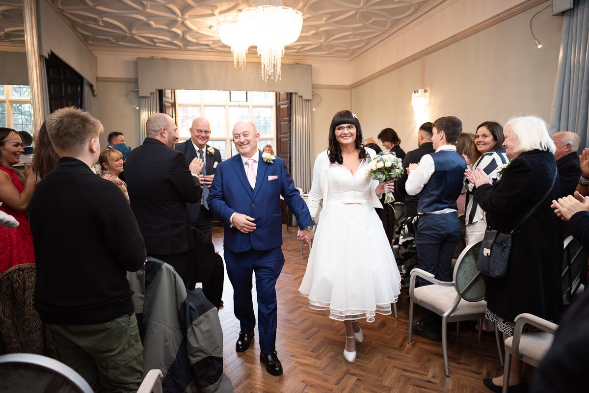 Andy and Caron depart the Ainsworth Room at Lewes Registry Office after becoming husband and wife.