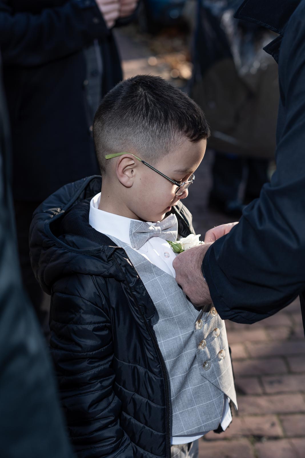 A wedding pin is put on Andy's grandson before his wedding to Caron at Lewes Registry Office.