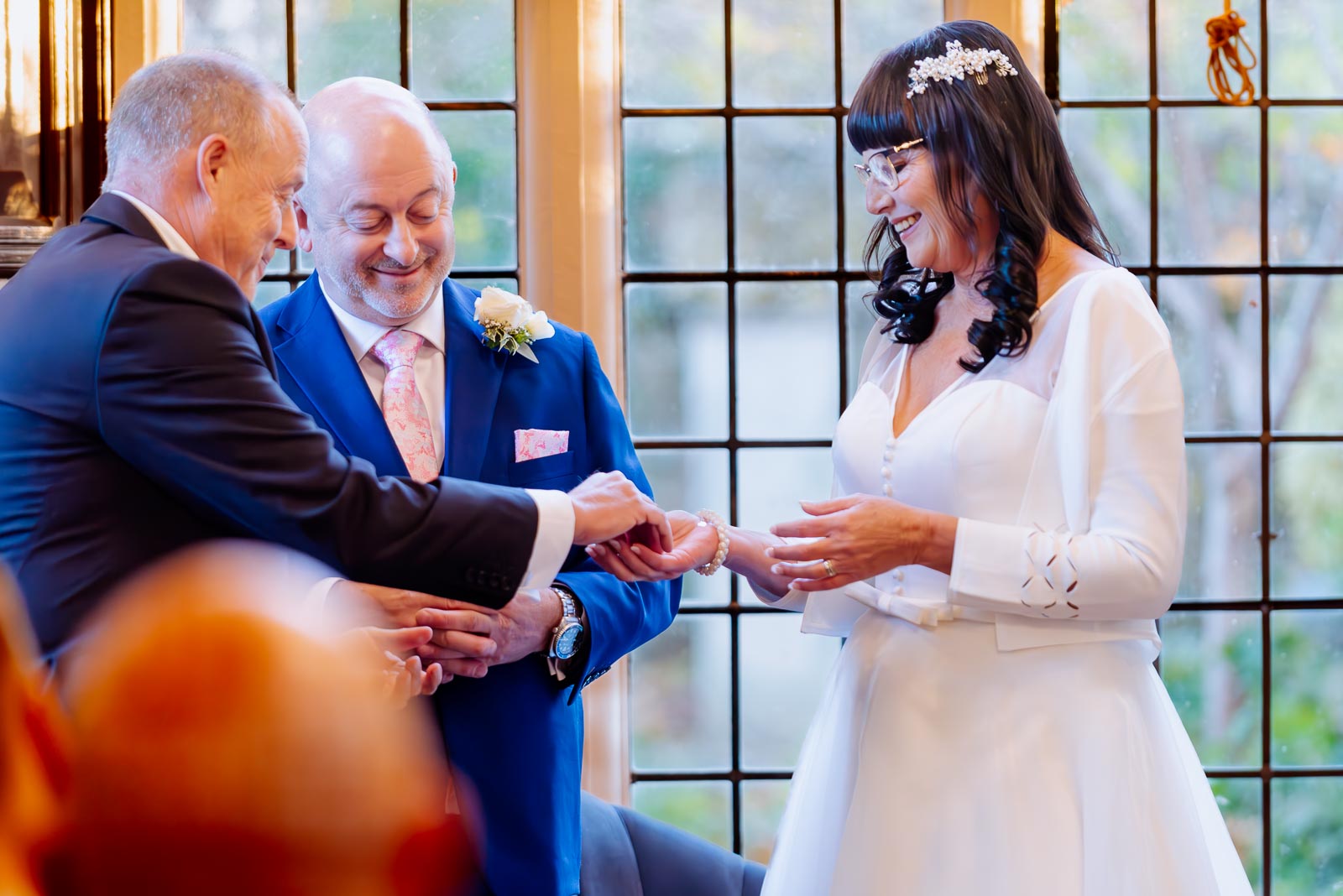 Andy's best man gives Caron the wedding ring in the Ainsworth Room at Lewes Registry Office.
