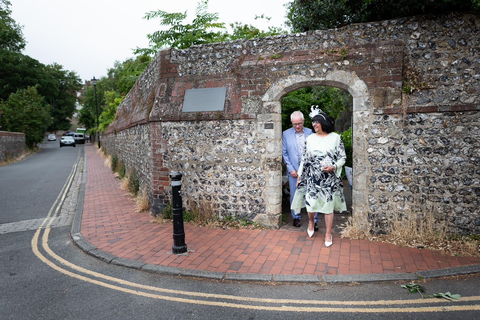 Ashifa and Julian walk through one of the beautiful walled gates at Southover Grange in Lewes