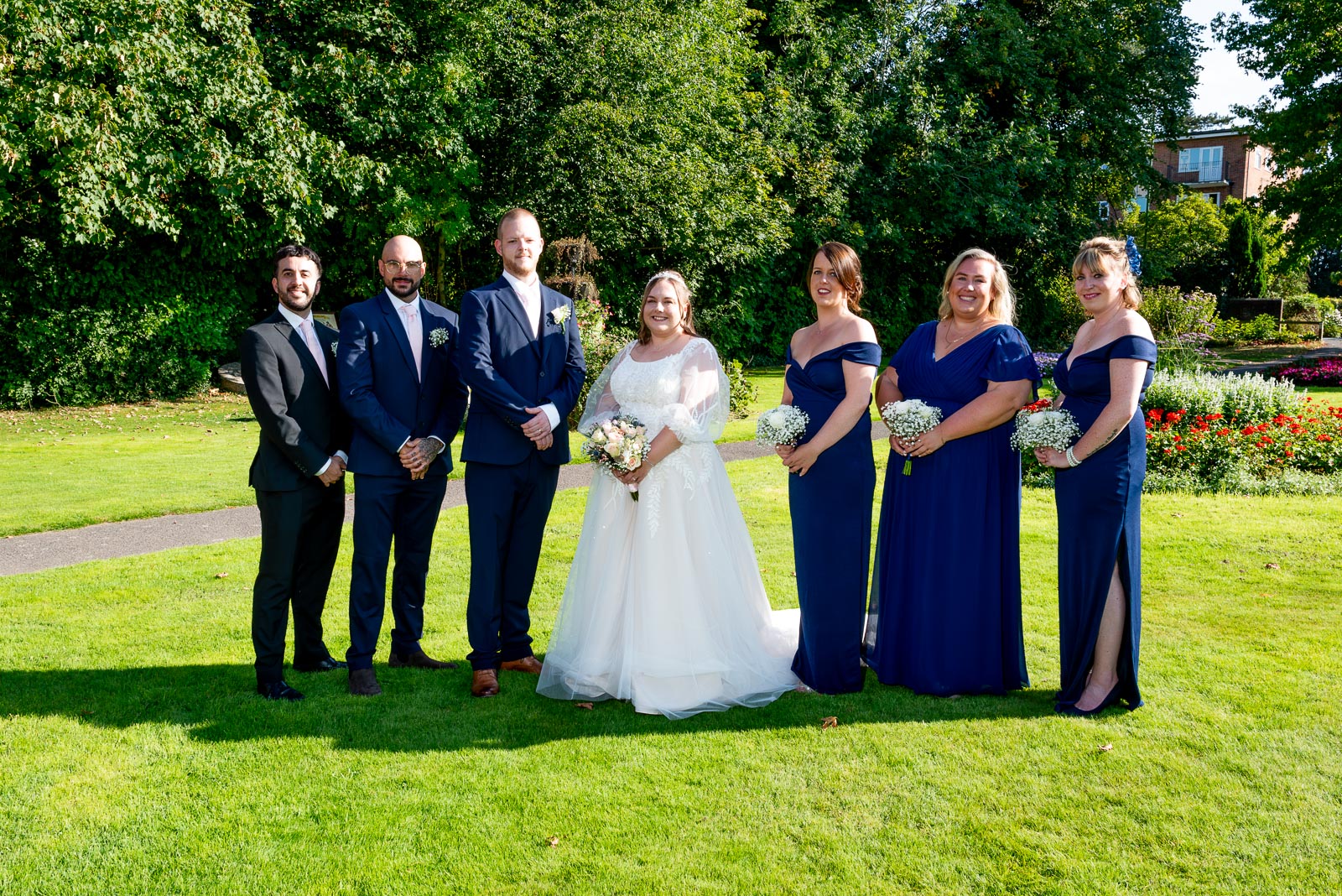 Catherine and Steve with the groomsmen and bridesmaids at Muster Green in Haywards Heath