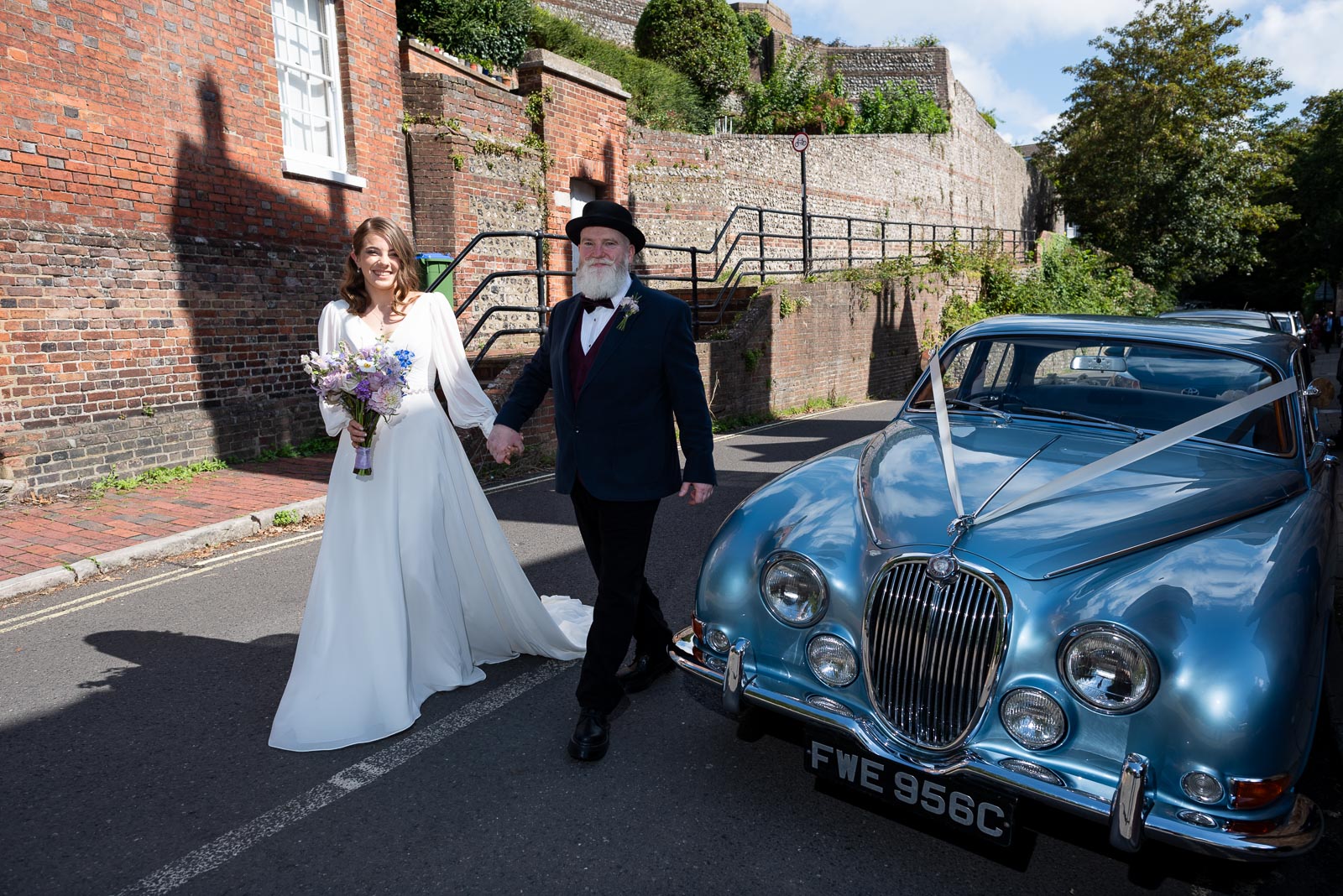 May arrives with her father at Lewes Register Office in a beautiful sky blue car