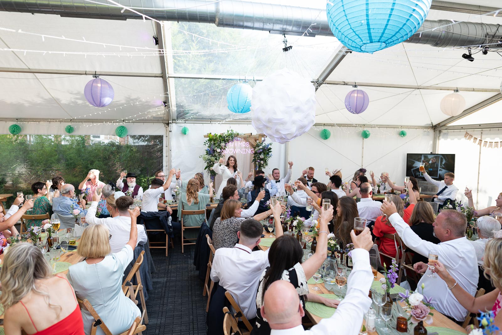 May makes a toast at the Wedding Breakfast in the garden of the Anchor Inn in Ringmer