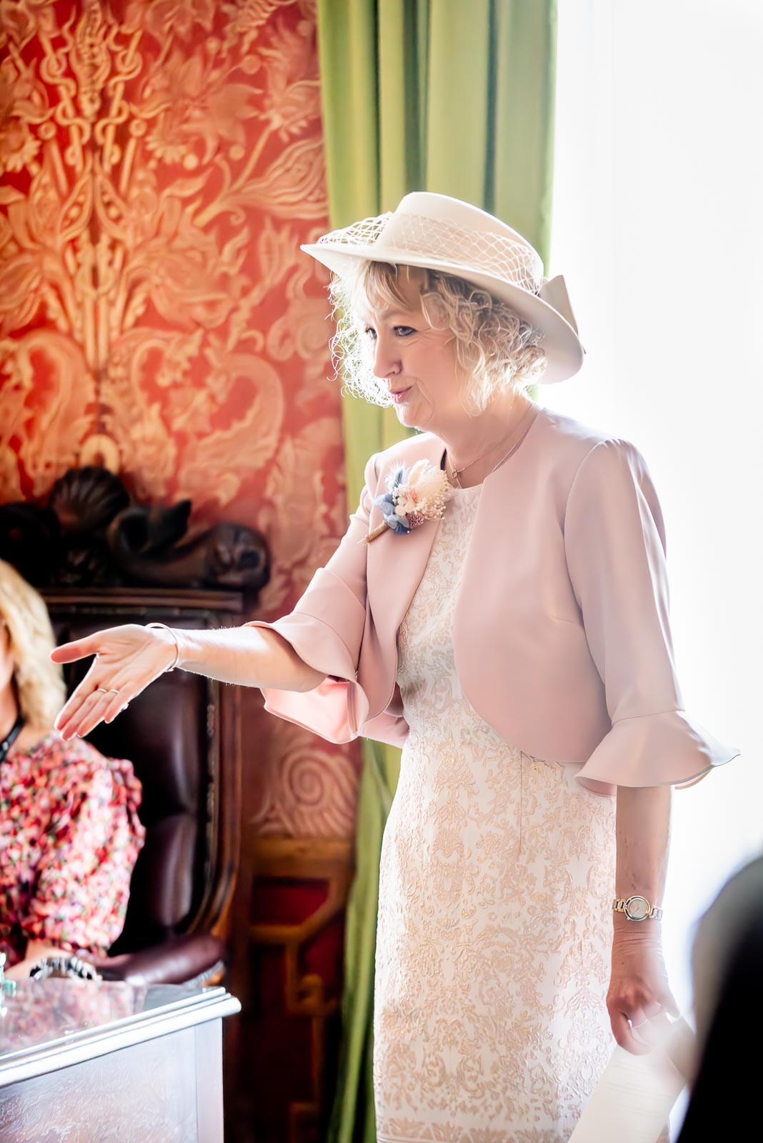 Georgina's mother Thelma blows a kiss after giving a reading in The Red Drawing Room at Brighton Royal Pavilion.