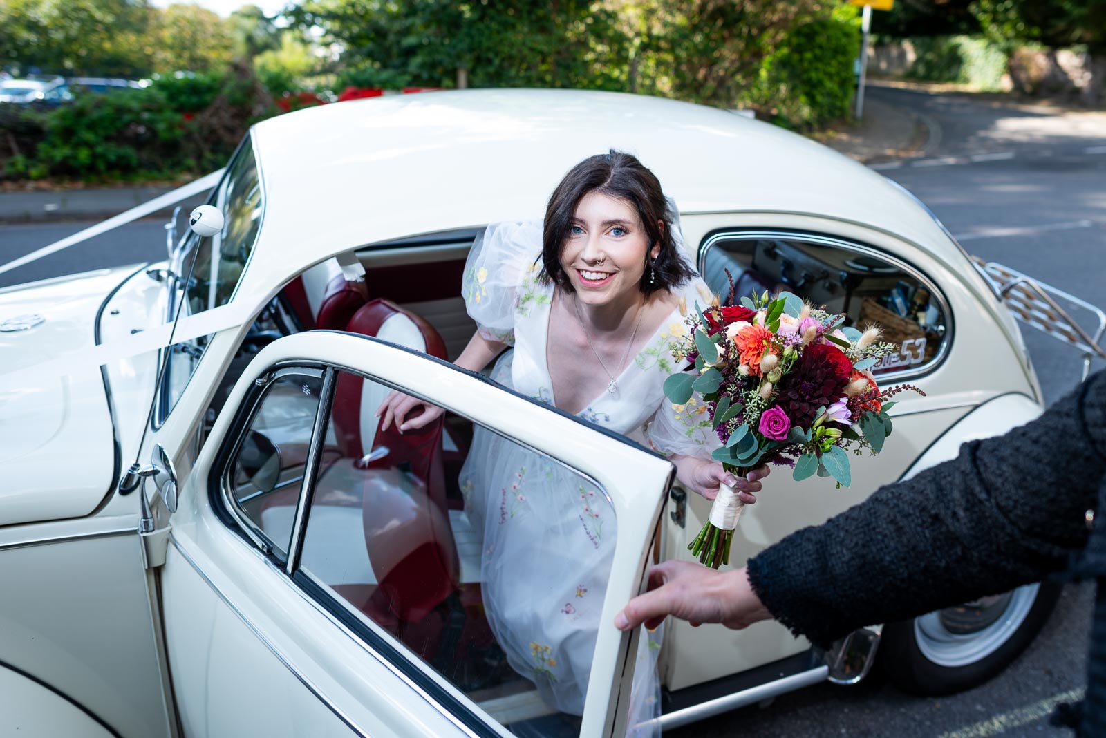 Lola arrives at Lewes Registry Office in a car supplied by Bus and Bug Vintage Weddings.