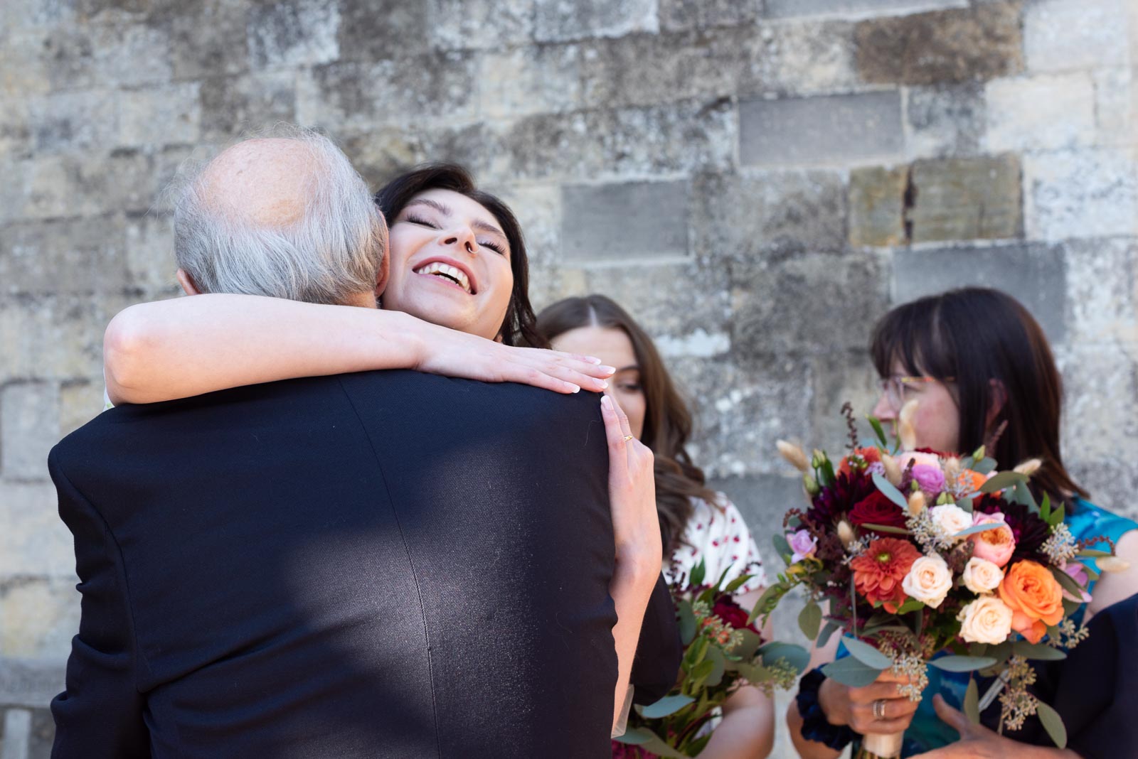 Lola hugs her grandfather in law in Southover Grange, Lewes after her wedding.