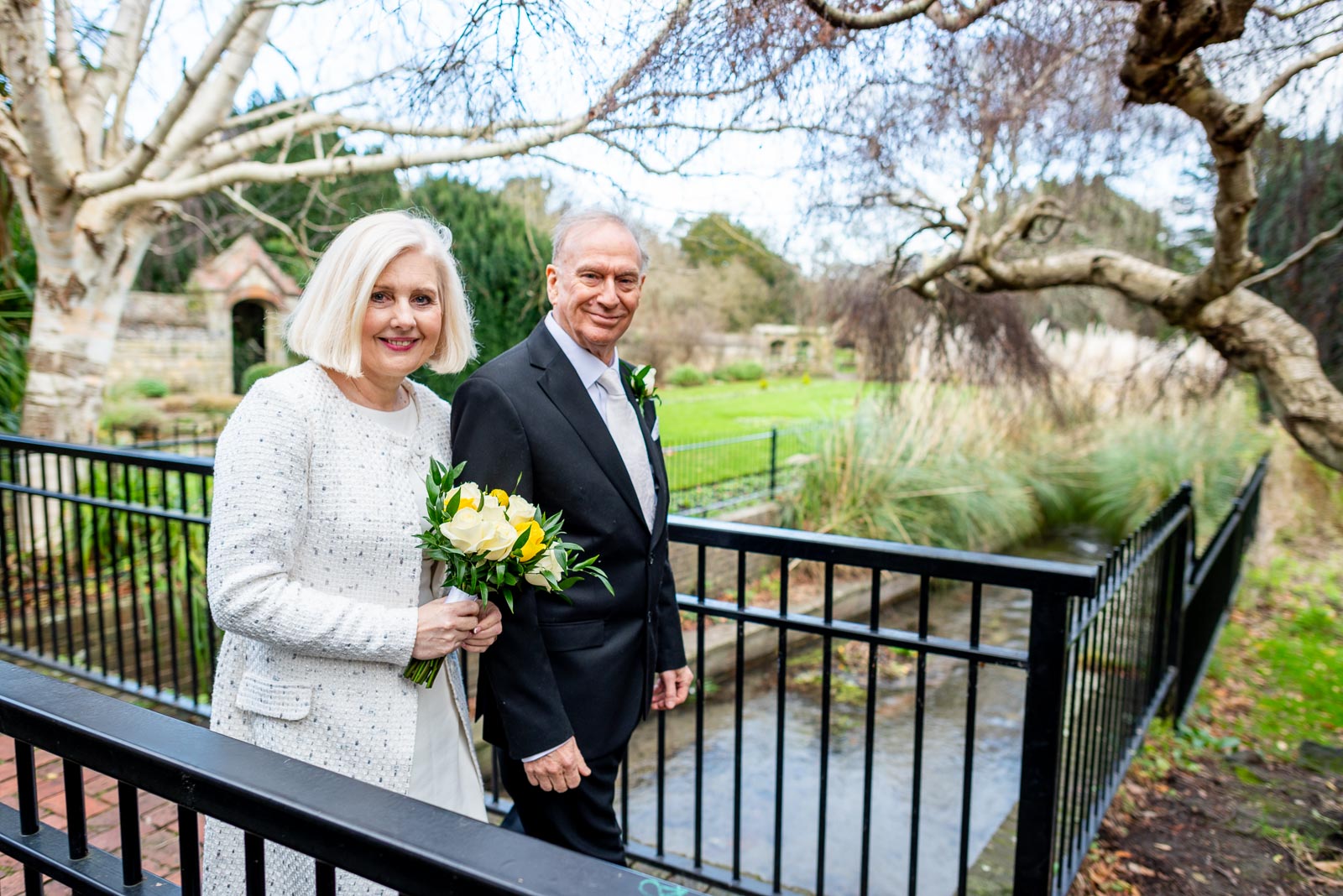 Peter and Dawn in Southover Grange crossing Winterbourne Stream after their wedding at Lewes Registry Office.