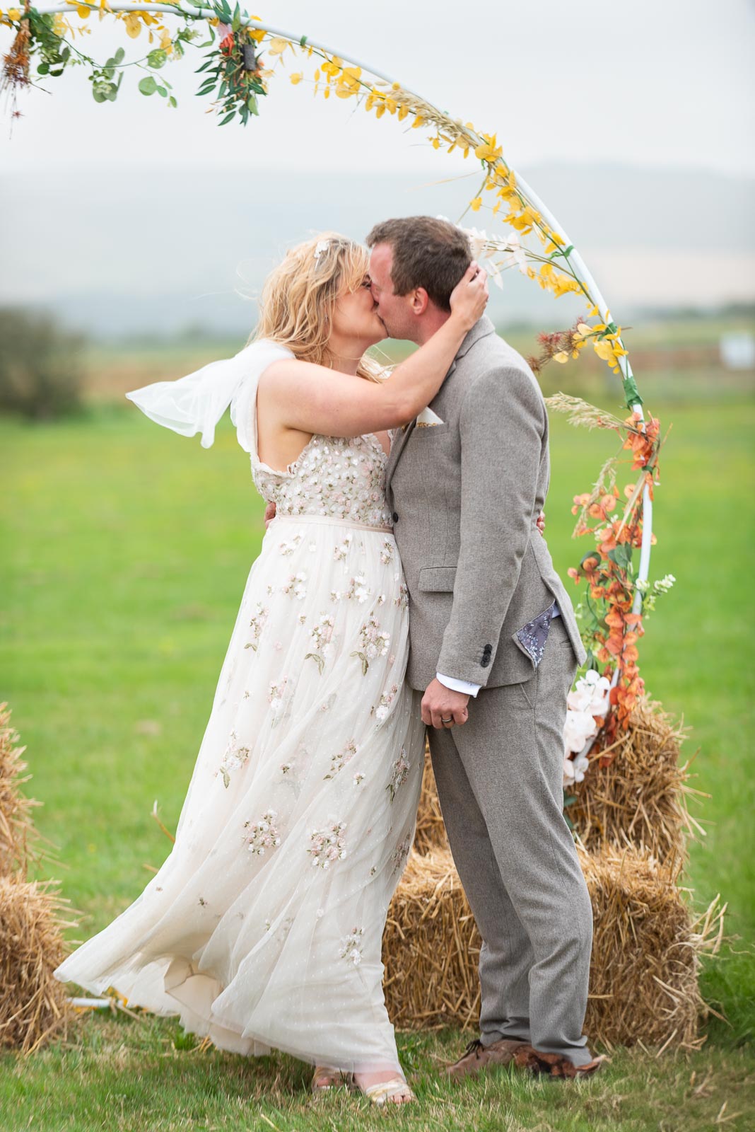 Eleanor and Marc kiss after becoming husband and wife at the Party Field near Lewes.