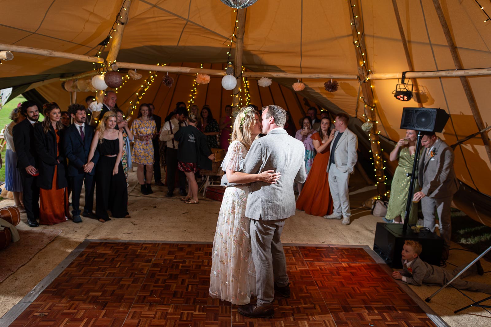 Eleanor and Marc kiss during their first dance at the Party Field near Lewes.