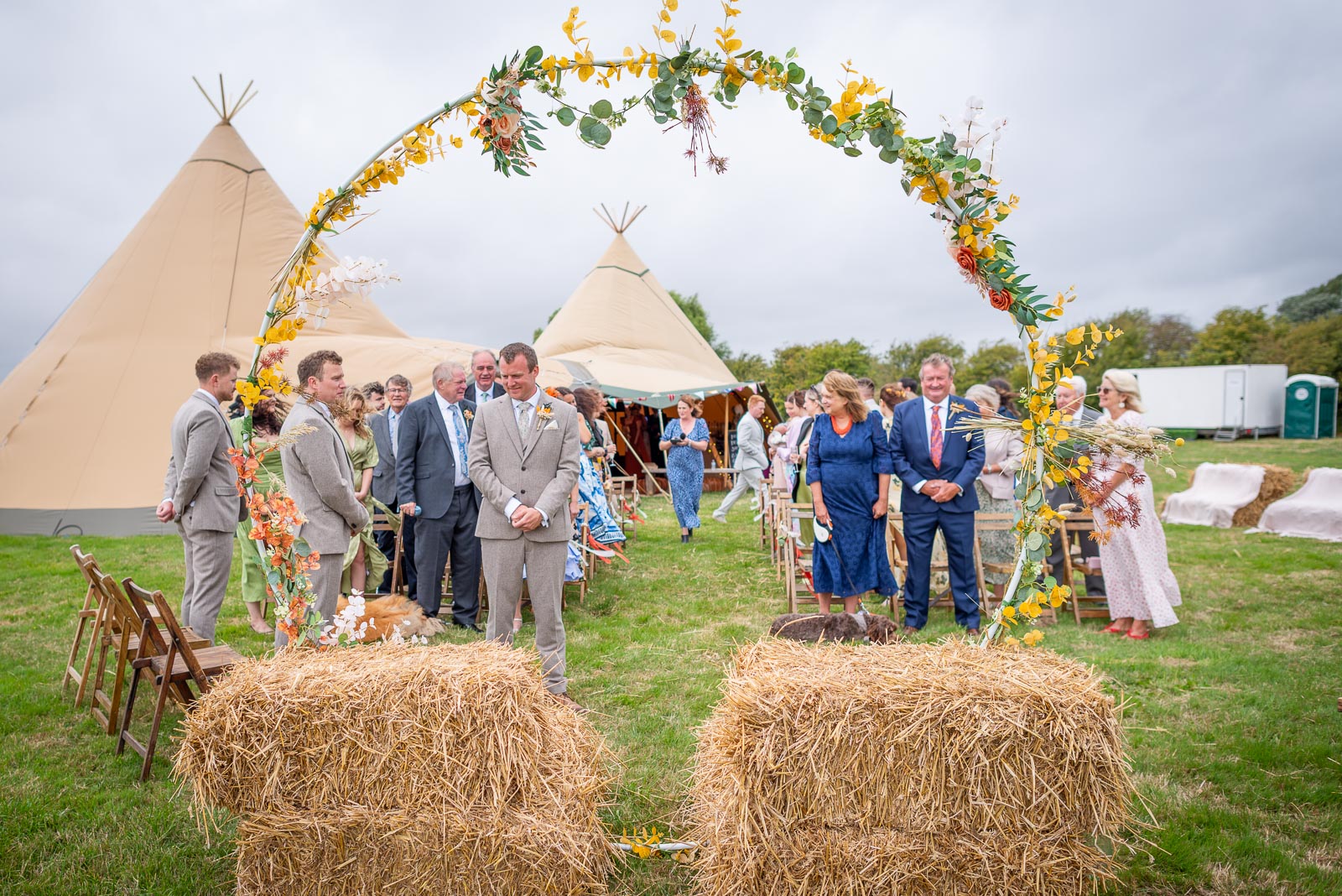 Marc waits patiently for his bride to be Eleanor to arrive at the Party Field near Lewes.