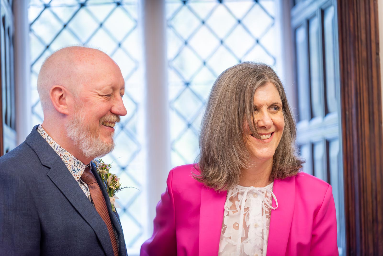 Helen and Tony enjoy a funny moment at the Evelyn room in Lewes Registry Office during their wedding