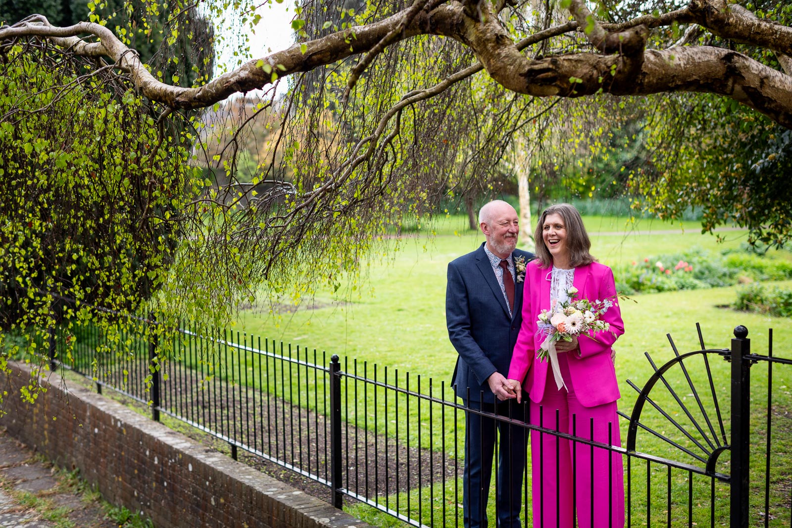 Helen and Tony enjoy a funny moment at Southover Grange in Lewes following their wedding