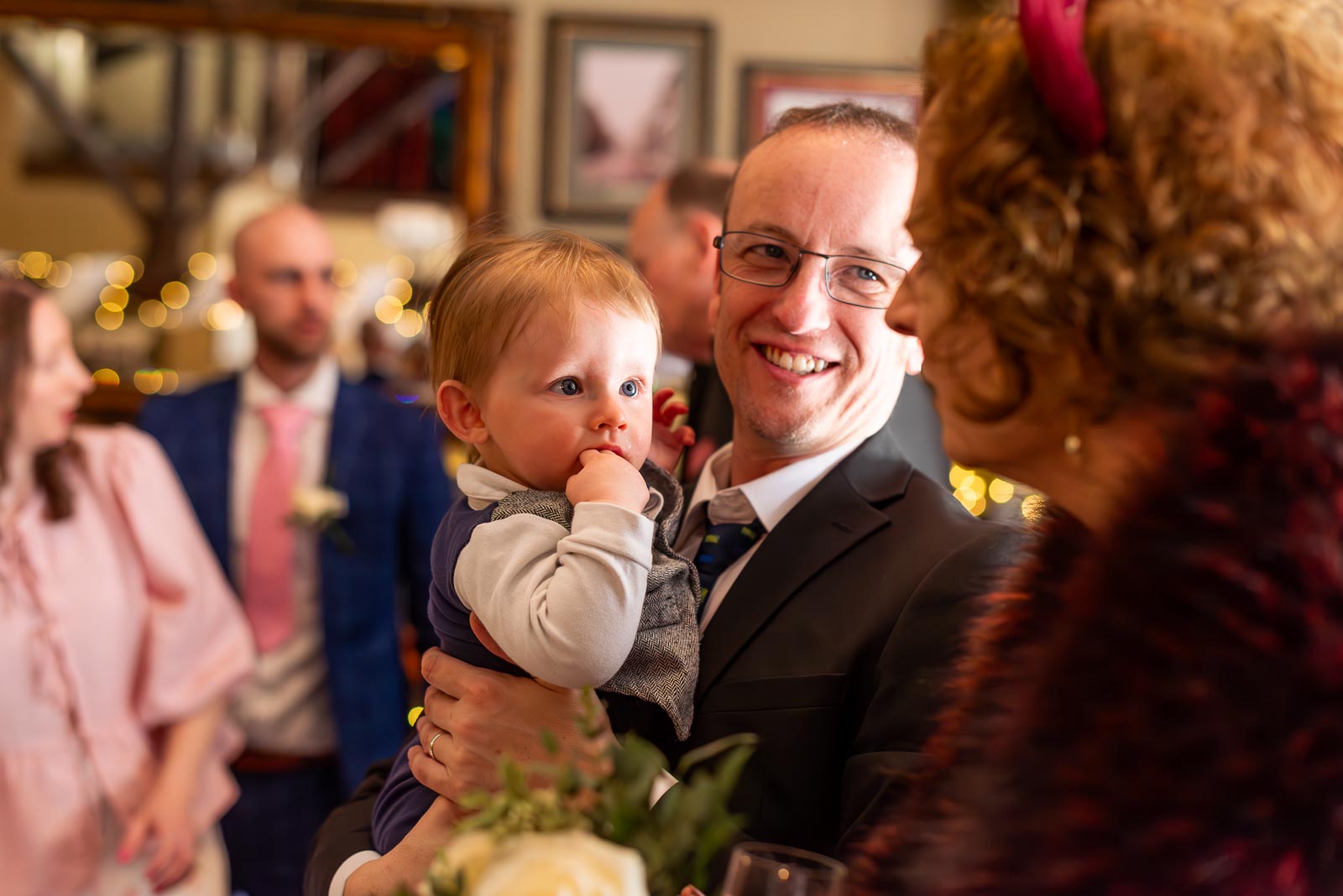 Jill greets a young guest at the John Harvey Tavern following her wedding to John in Lewes