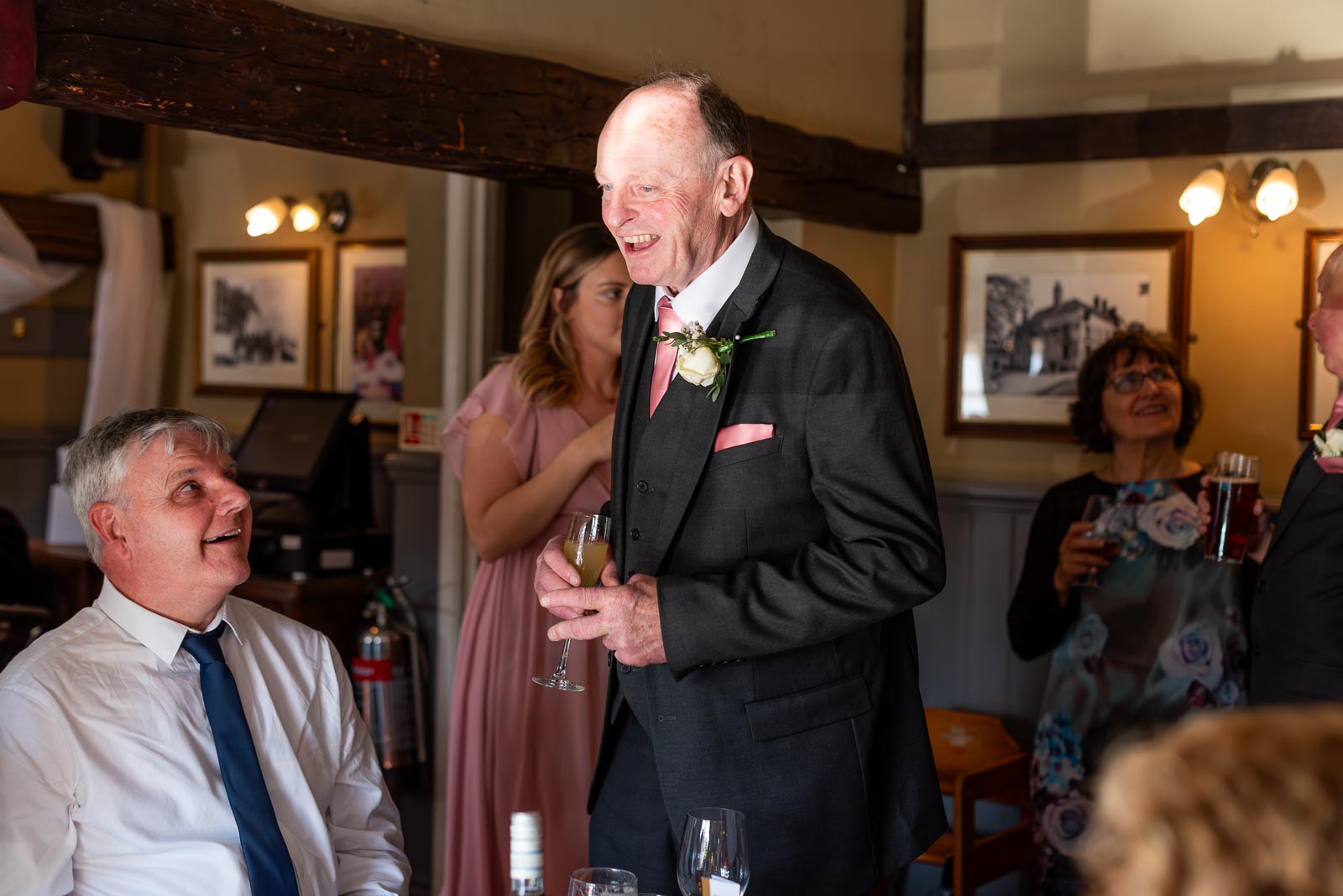 John greets a guests at the John Harvey Tavern following his wedding to Jill in Lewes