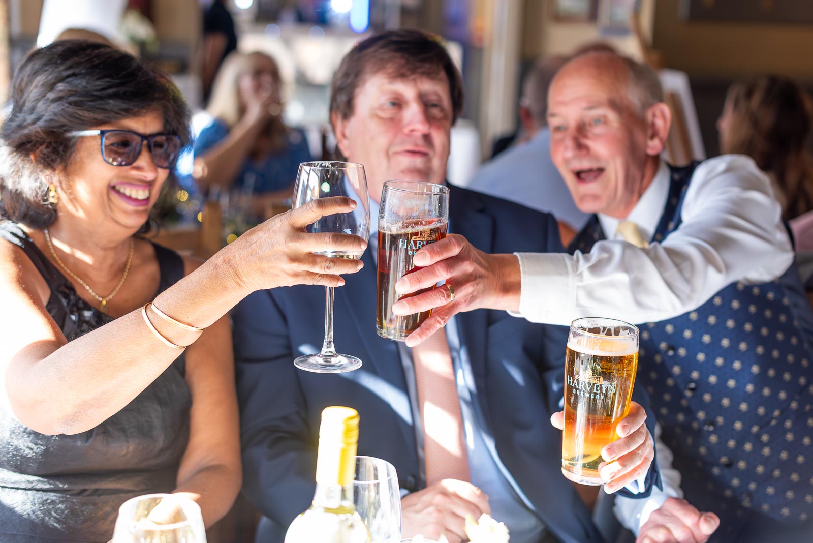 Guests toast the bride and grooms health at the John Harvey Tavern Lewes