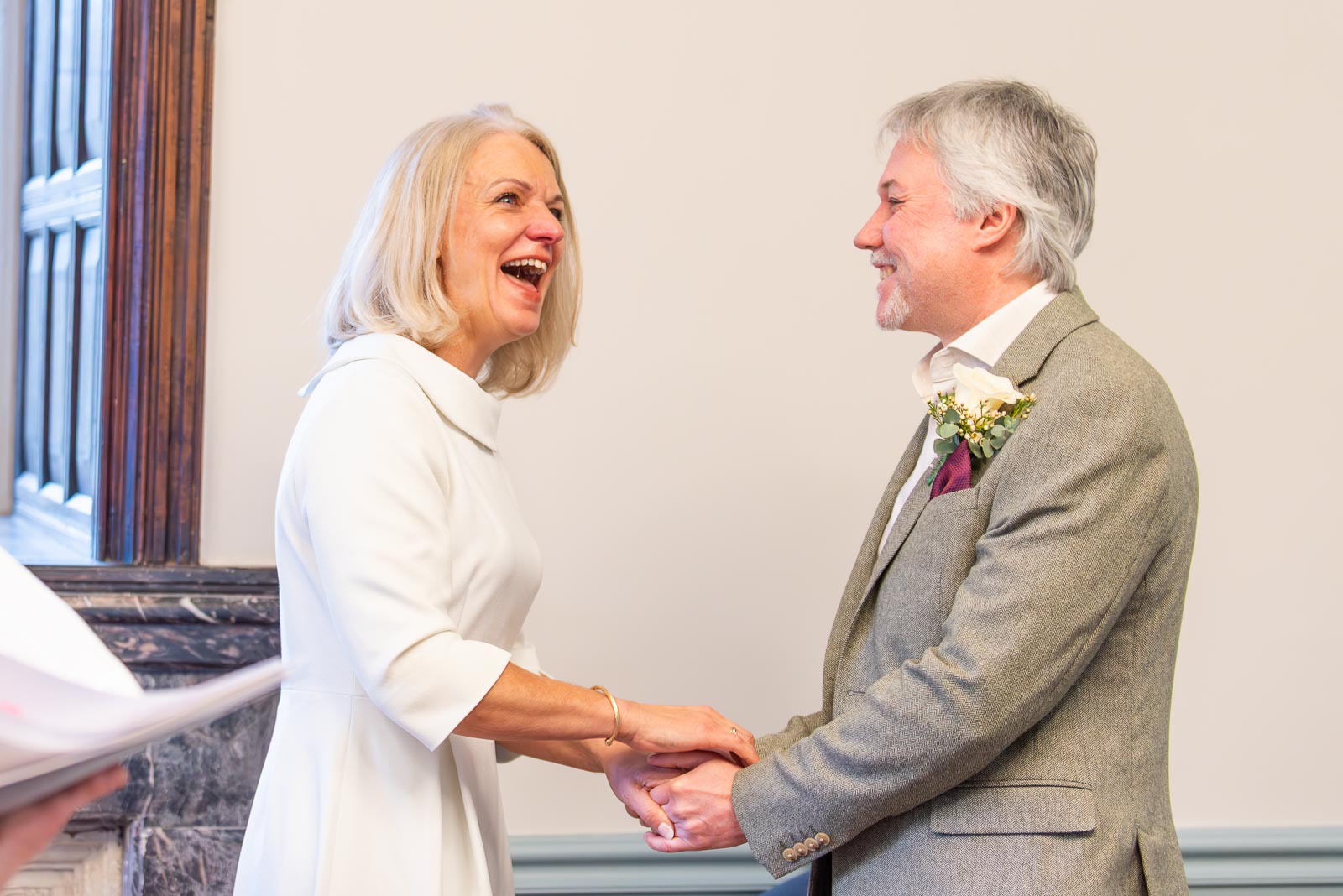 Jo and Darren enjoy a funny moment during their wedding vows in Lewes Registry Office