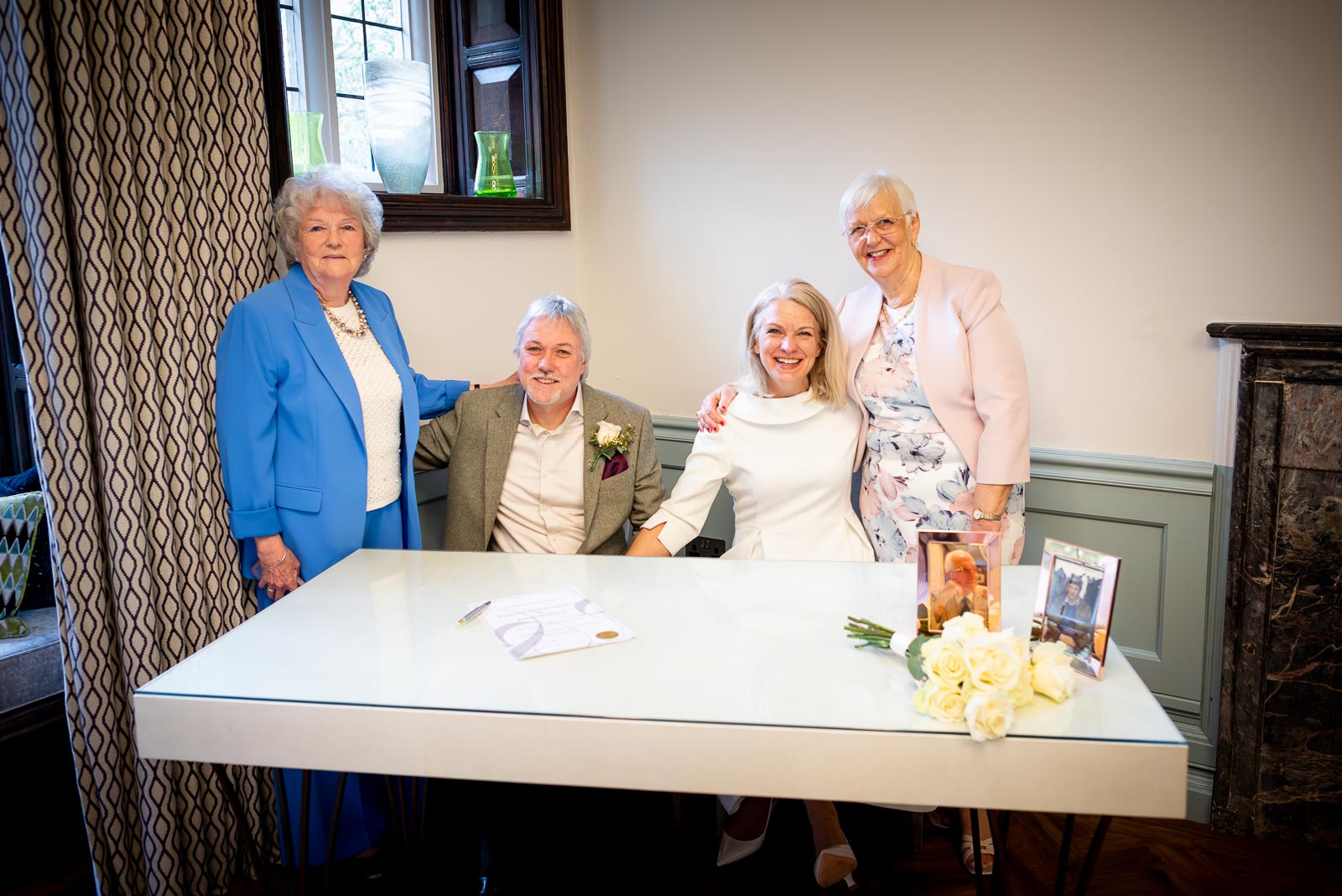 Jo and Darren sign their the wedding certificate in the Evelyn Room at Lewes Registry Office