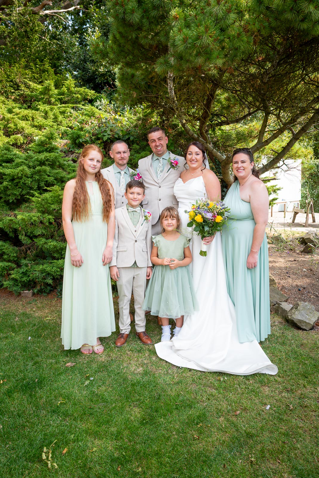 Tamsyn, Karl and their blended family including best man and maid of honour  in the Garden at The Jolly Sportsman in Chiltington near Lewes. 