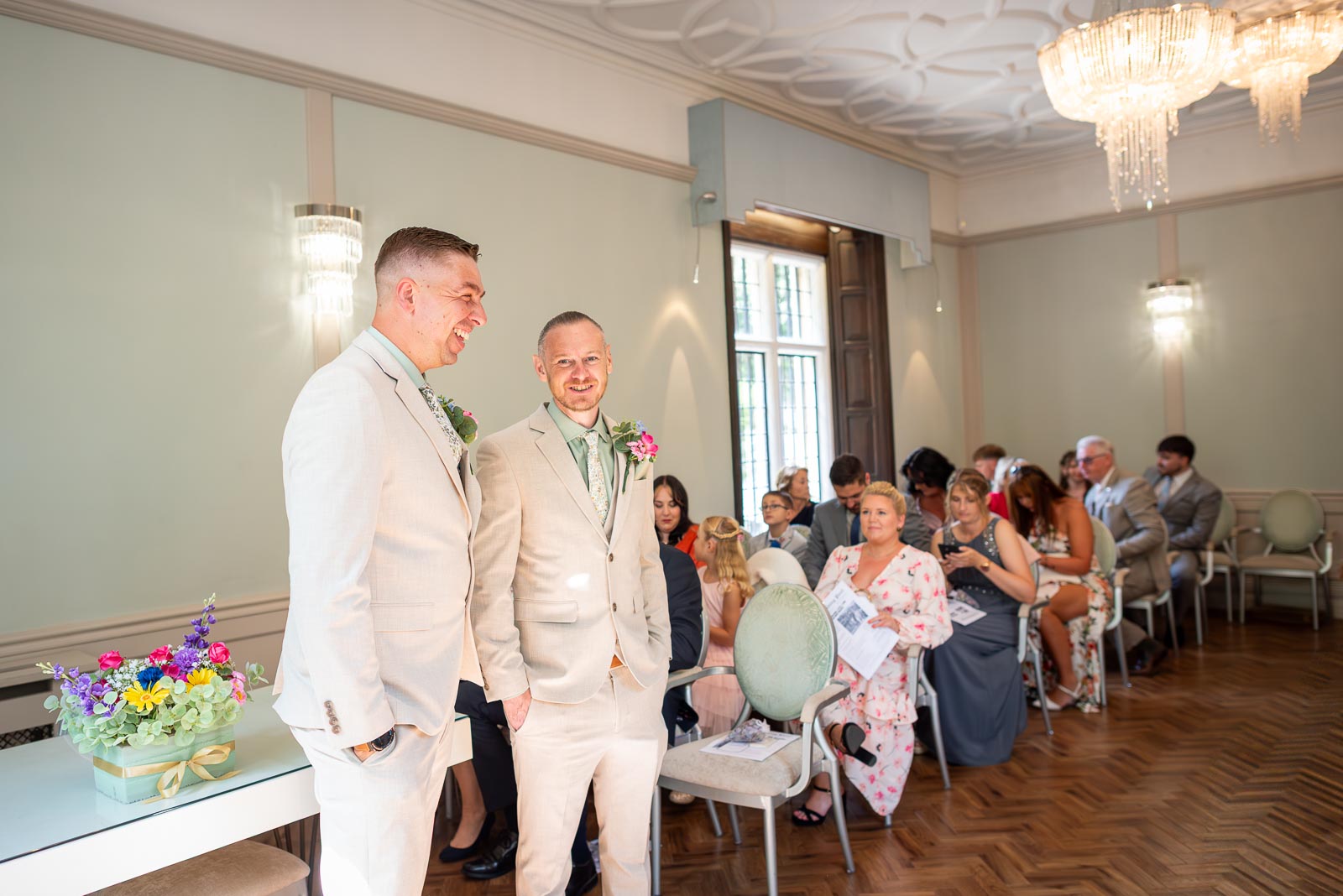 Karl and his best man enjoy a funny moment before his wedding to Tamsyn in the Ainsworth Room at Lewes Registry Office.