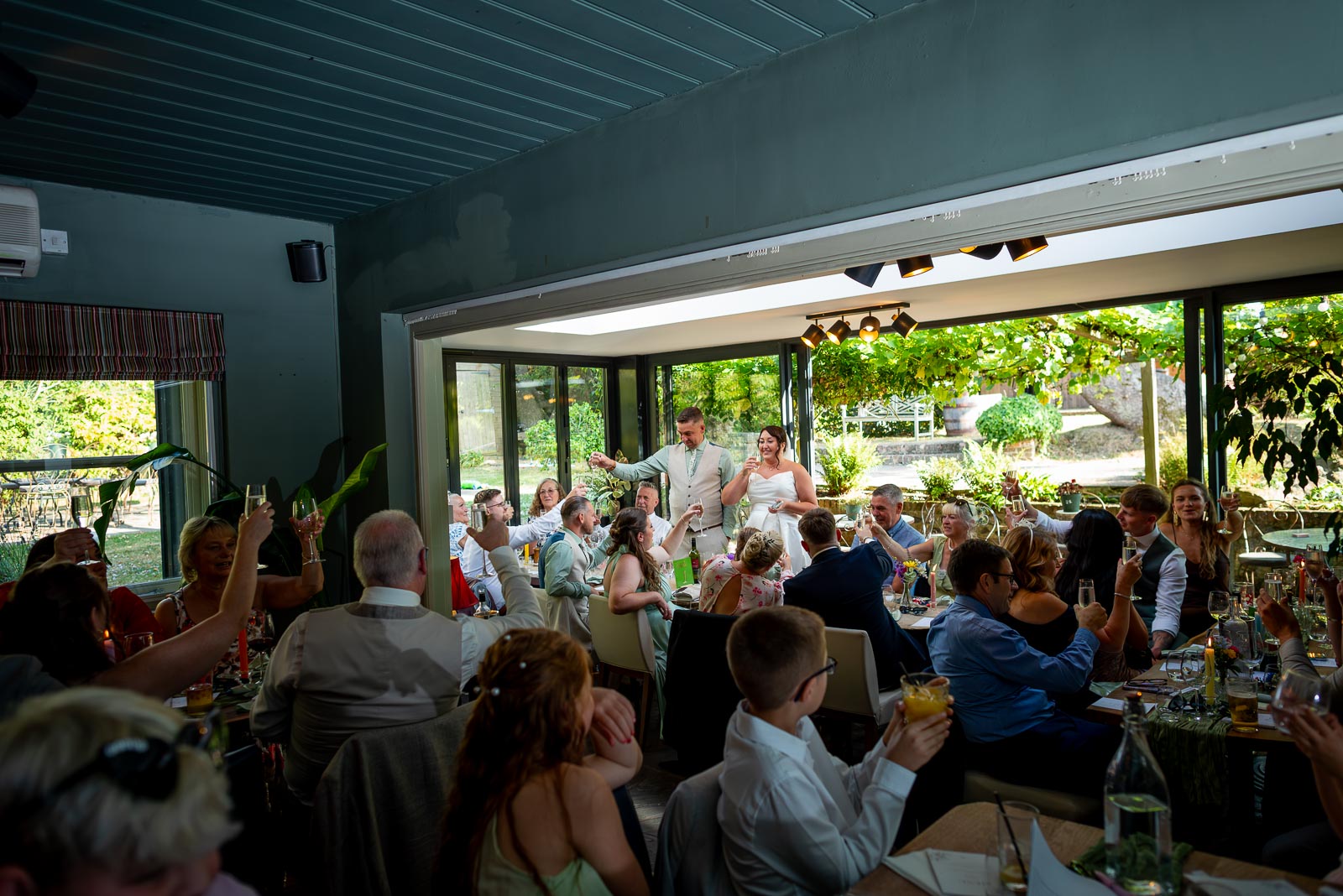 Tamsyn and Karl toast their guests health in the function room of The Jolly Sportsman during their Wedding Reception. 