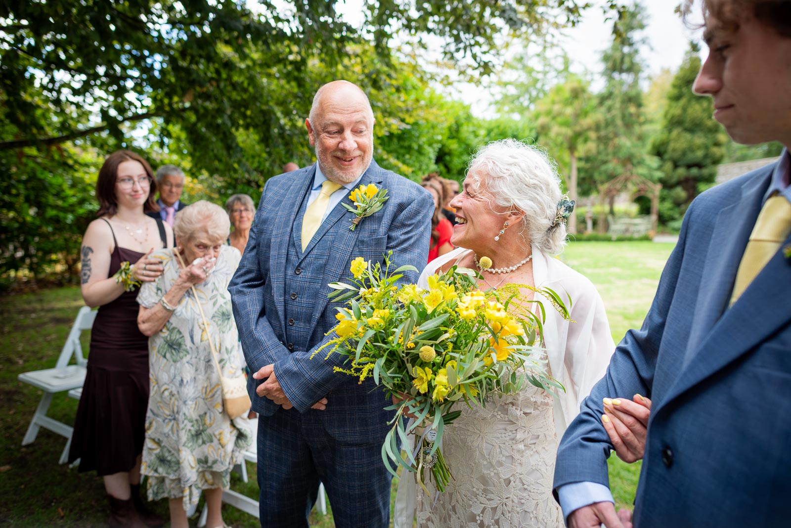 Karen and Hugh arrive at the bottom of the aisle before their wedding in the Gradens at Pelham House Hotel, Lewes.