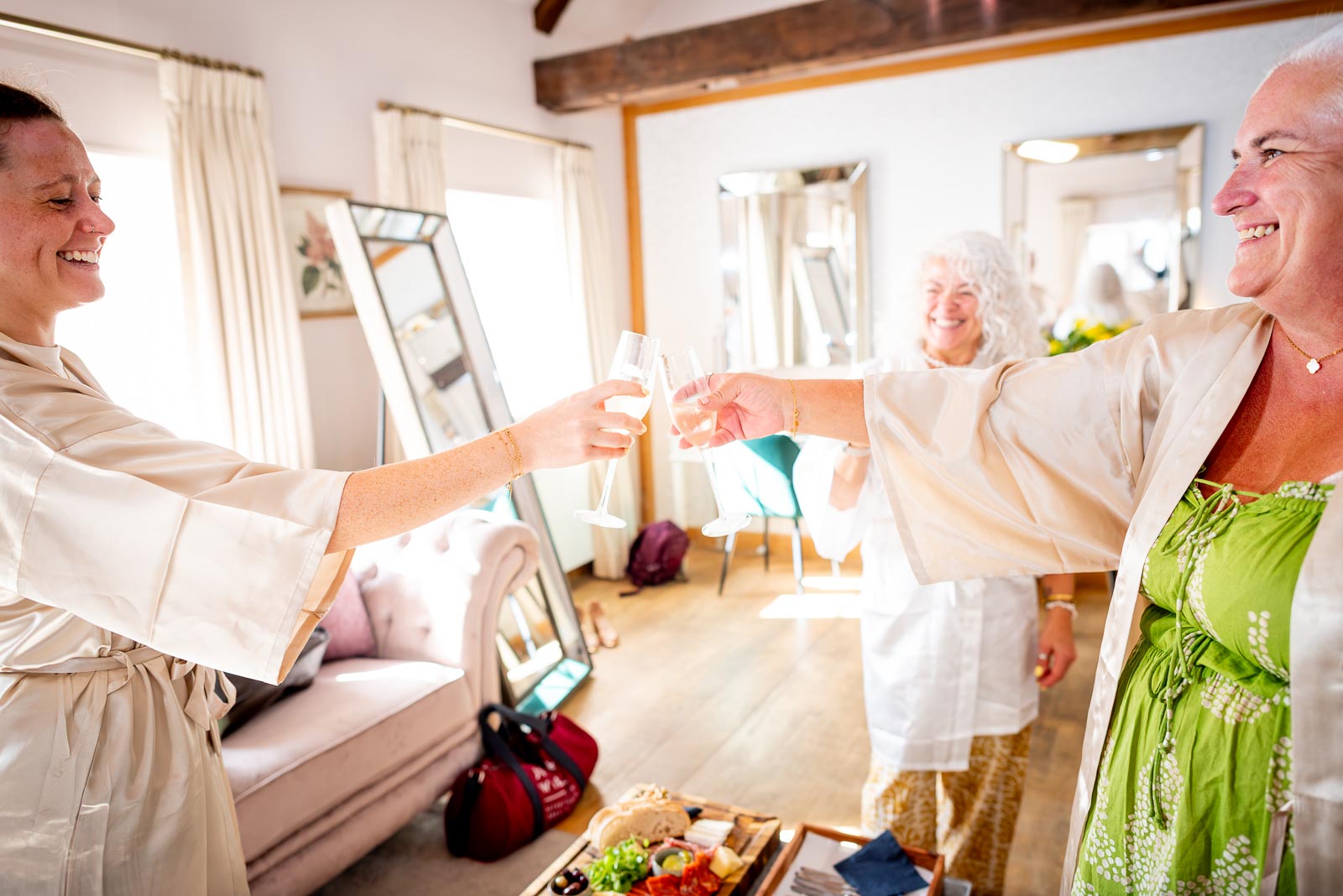 Karen, her maid of honour and her daughter have a toast in The Courthope Mews before Karen's wedding to Hugh at Pelham House Hotel, Lewes.