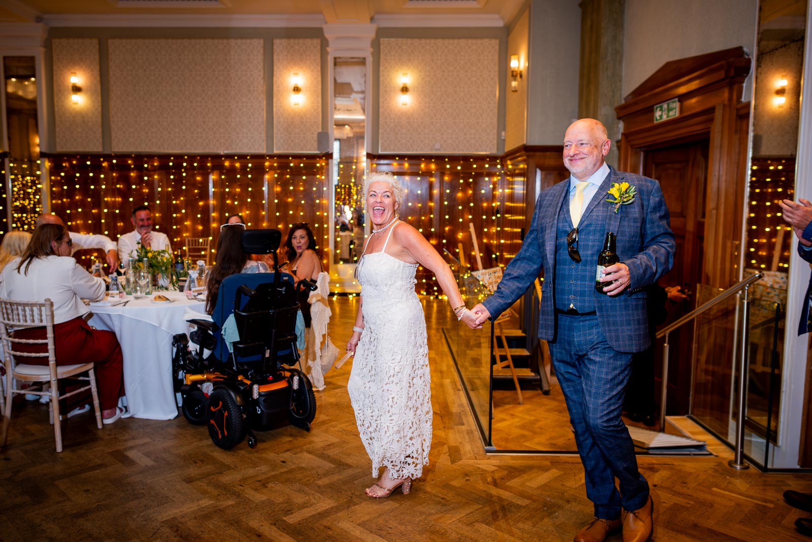 Karen and Hugh enter the Blencowe Room for their Wedding Breakfast at Pelham House in Lewes following their wedding. 