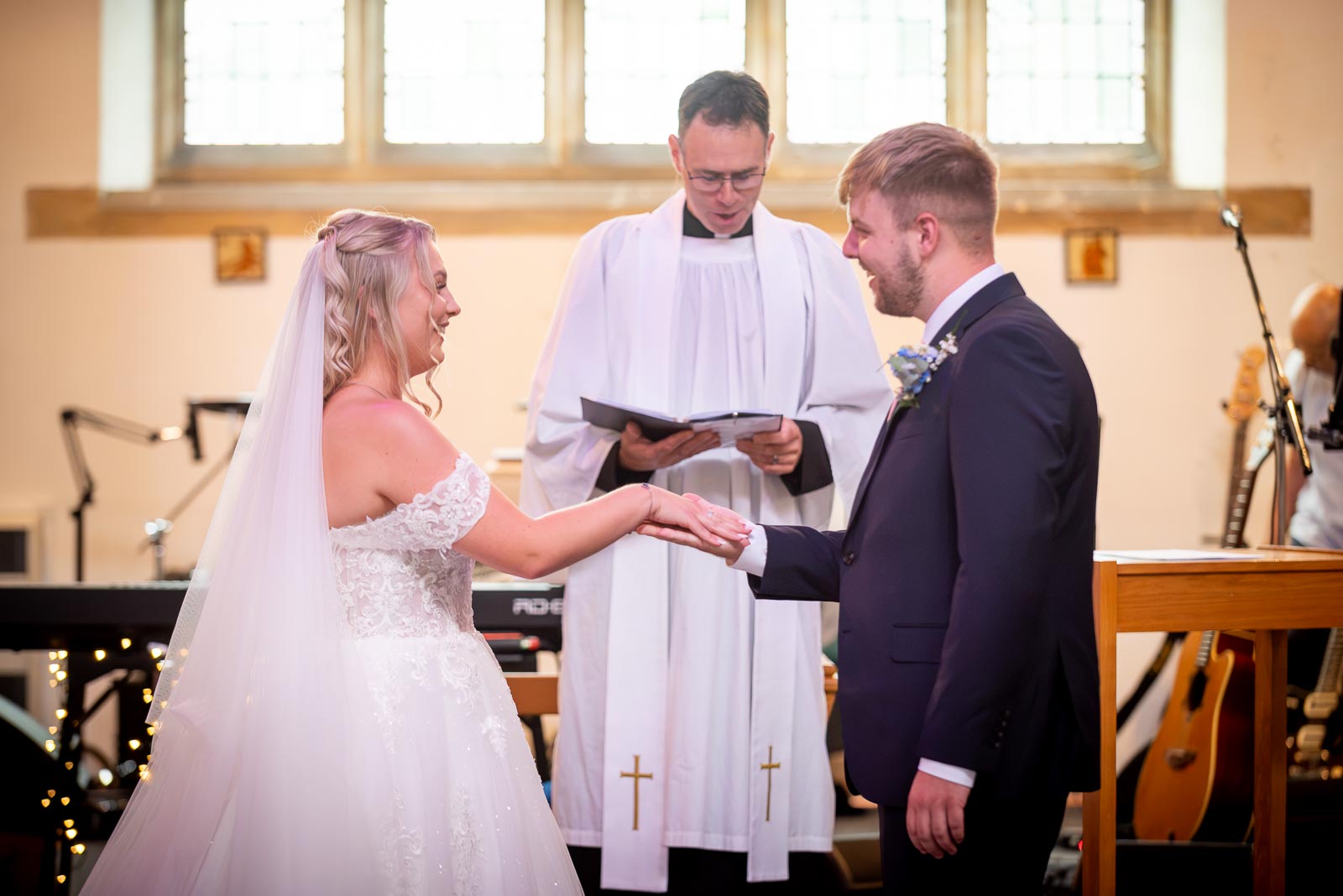 Shannon and Brandon at the bottom ofd the aisle in St. Michael and All Angels Church in Eastbourne during their wedding.