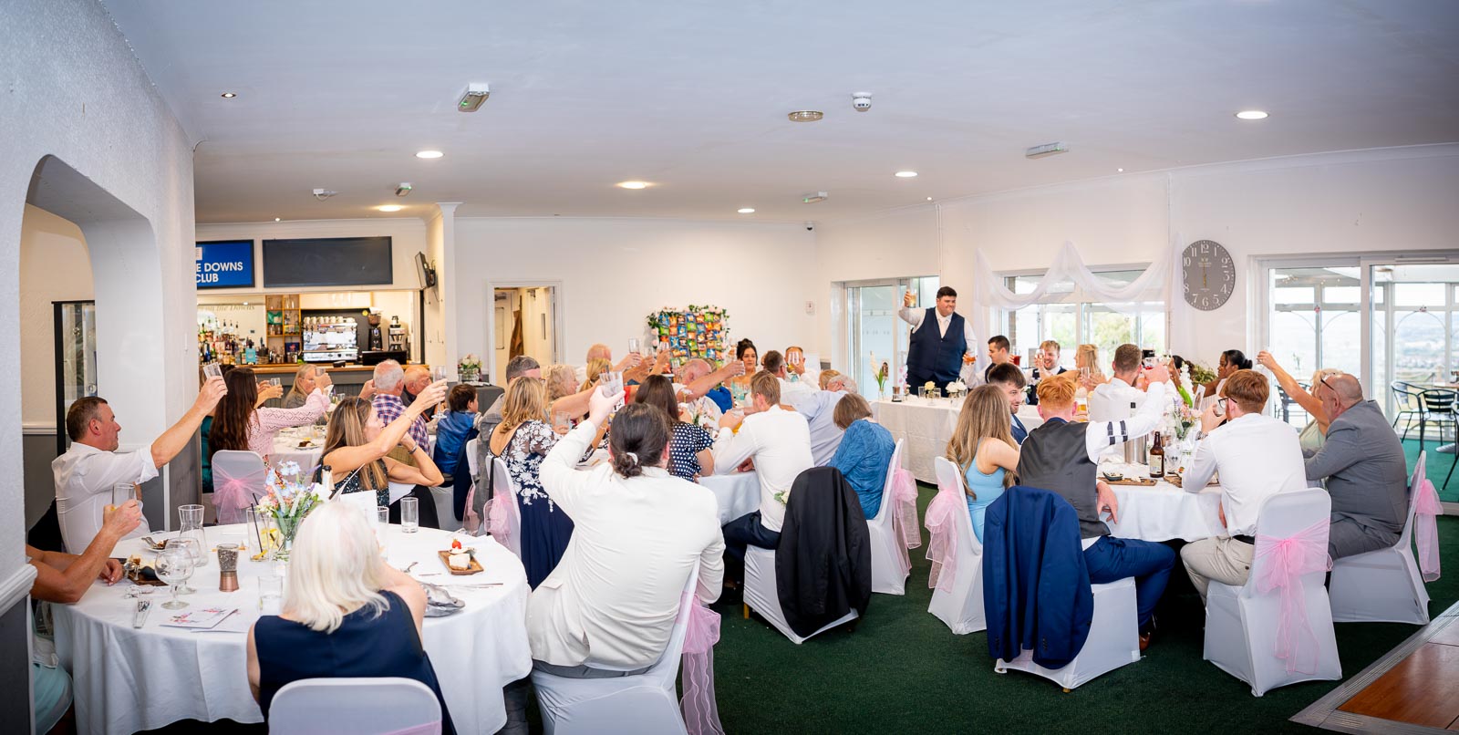 Brandon's best man proposes a toast to the couple during their wedding breakfast at Eastbourne Downs Golf Club.