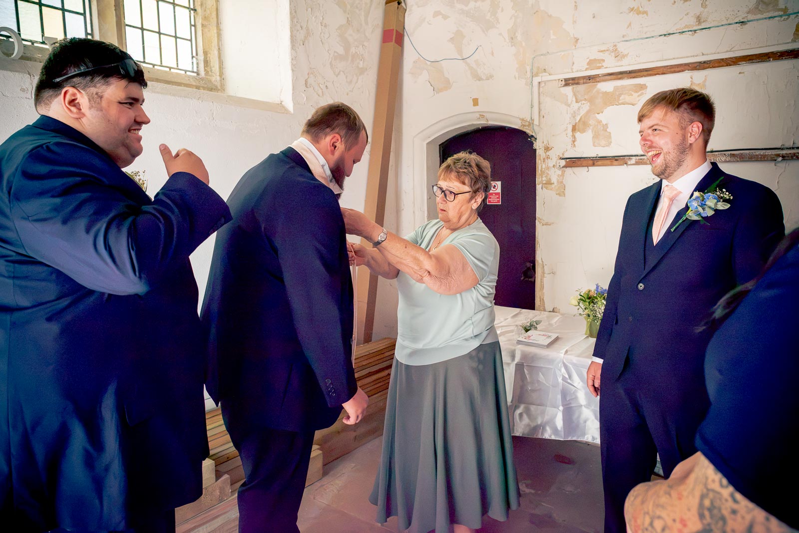 Brandon and his best men enjoy a funny moment before his wedding to Shannon at St. Michael and All Angels Church in Eastbourne.