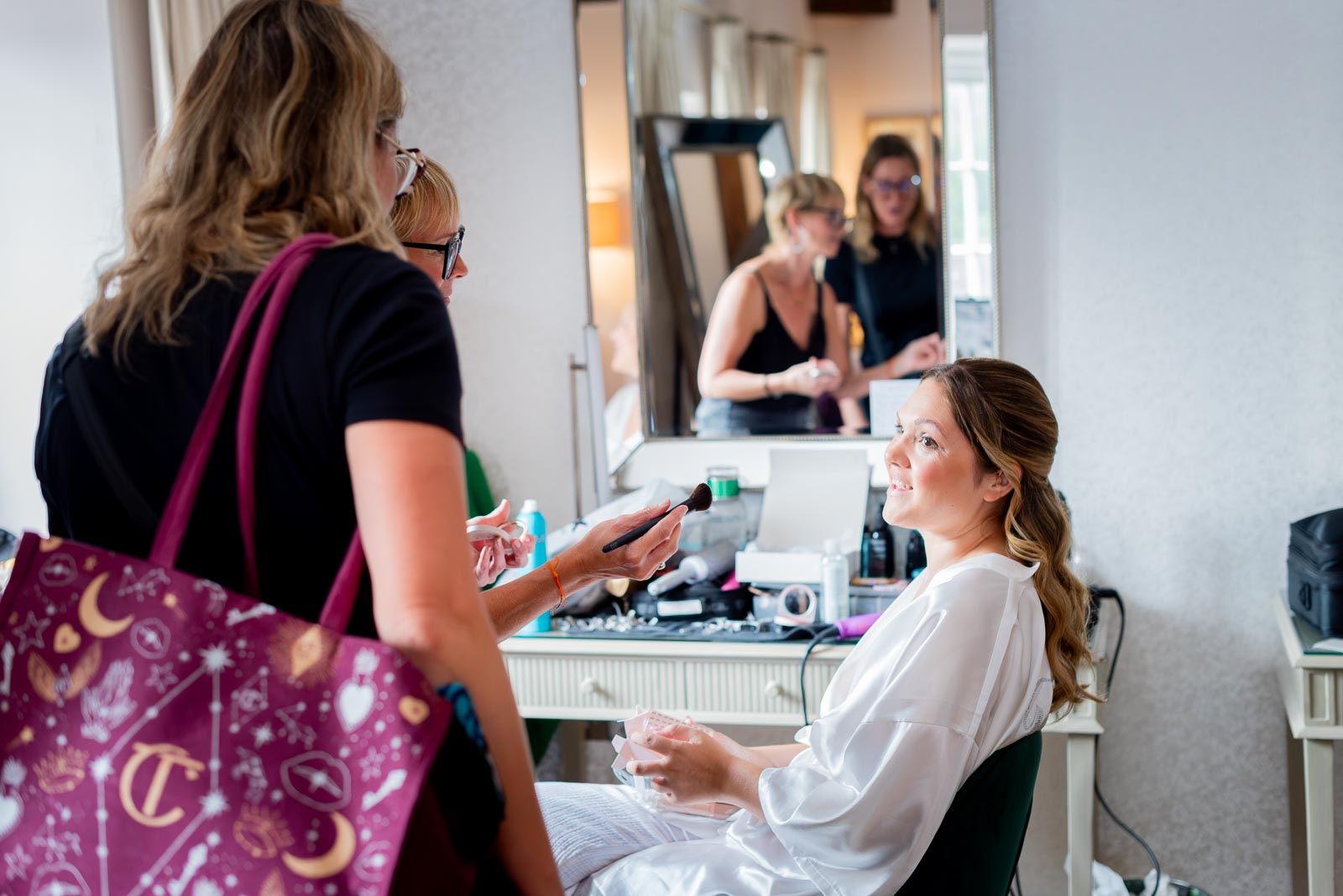 Sarah chats with her hairdresser and makeup artist in The Courthope Mews before Sarah's wedding to Lewis at Pelham House Hotel, Lewes.
