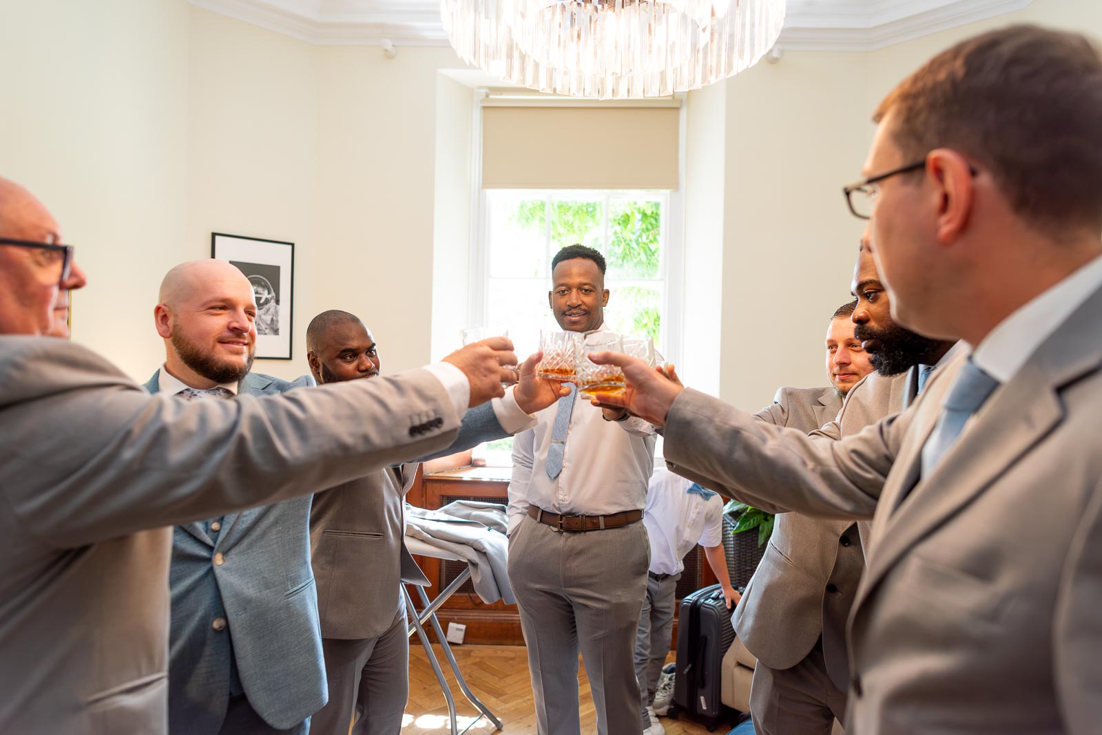 Lewis has a toast with his best men before his wedding to Sarah at Pelham House Hotel, Lewes.