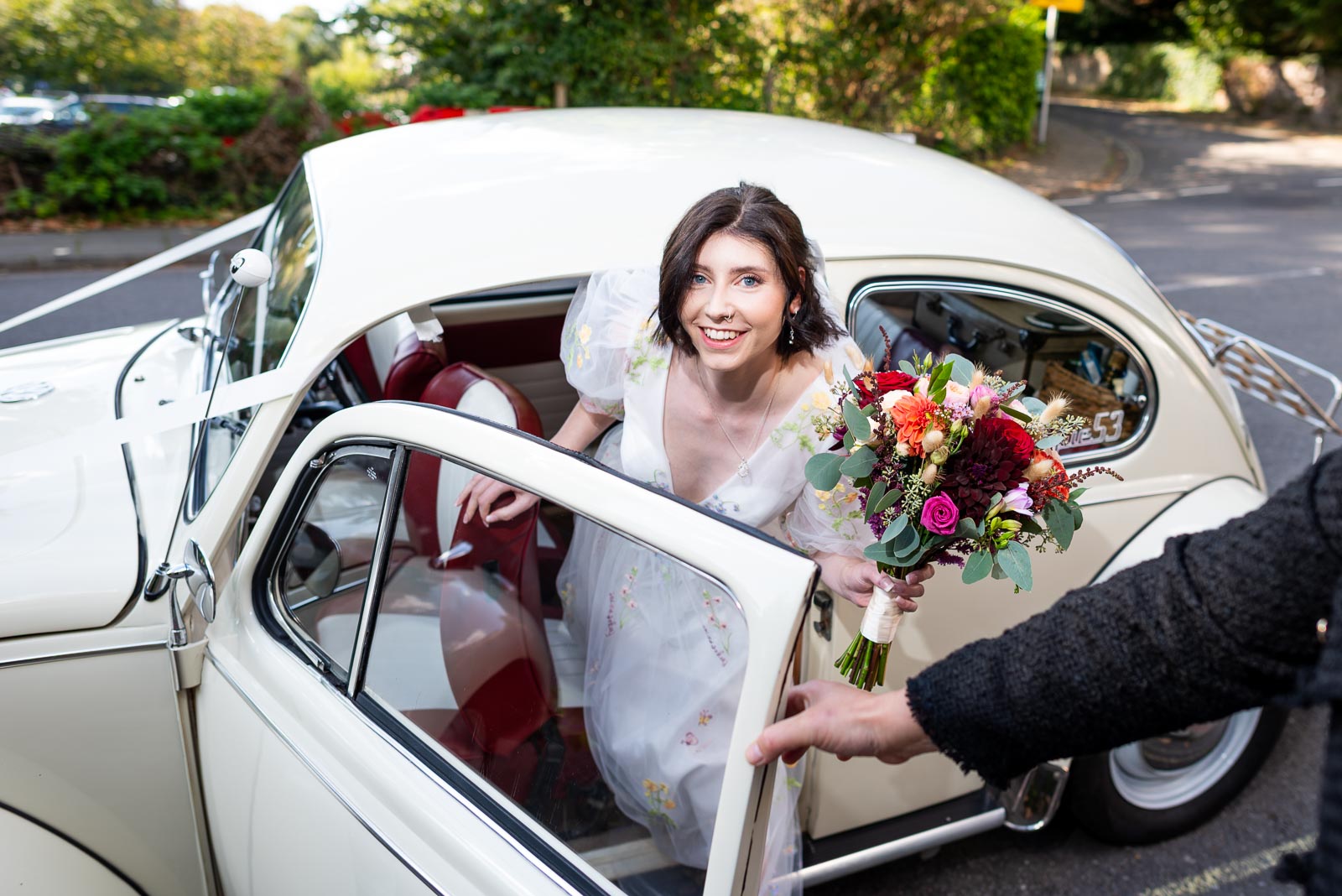 Lola arrives at Lewes Registry Office in a car supplied by Bus and Bug Vintage Weddings