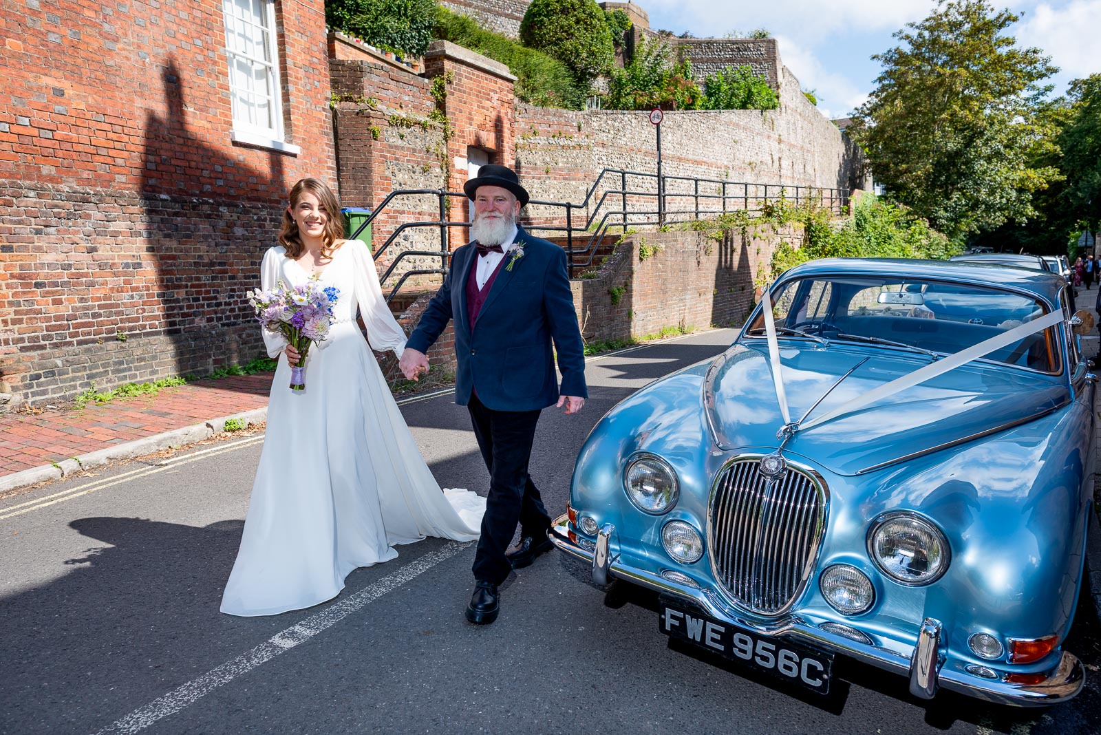 May arrives with her father at Lewes Register Office in a beautiful sky blue car