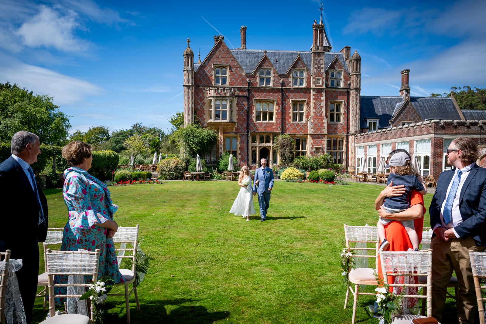 Jess walks down the garden before her wedding to Fred at Horsted Place Hotel 