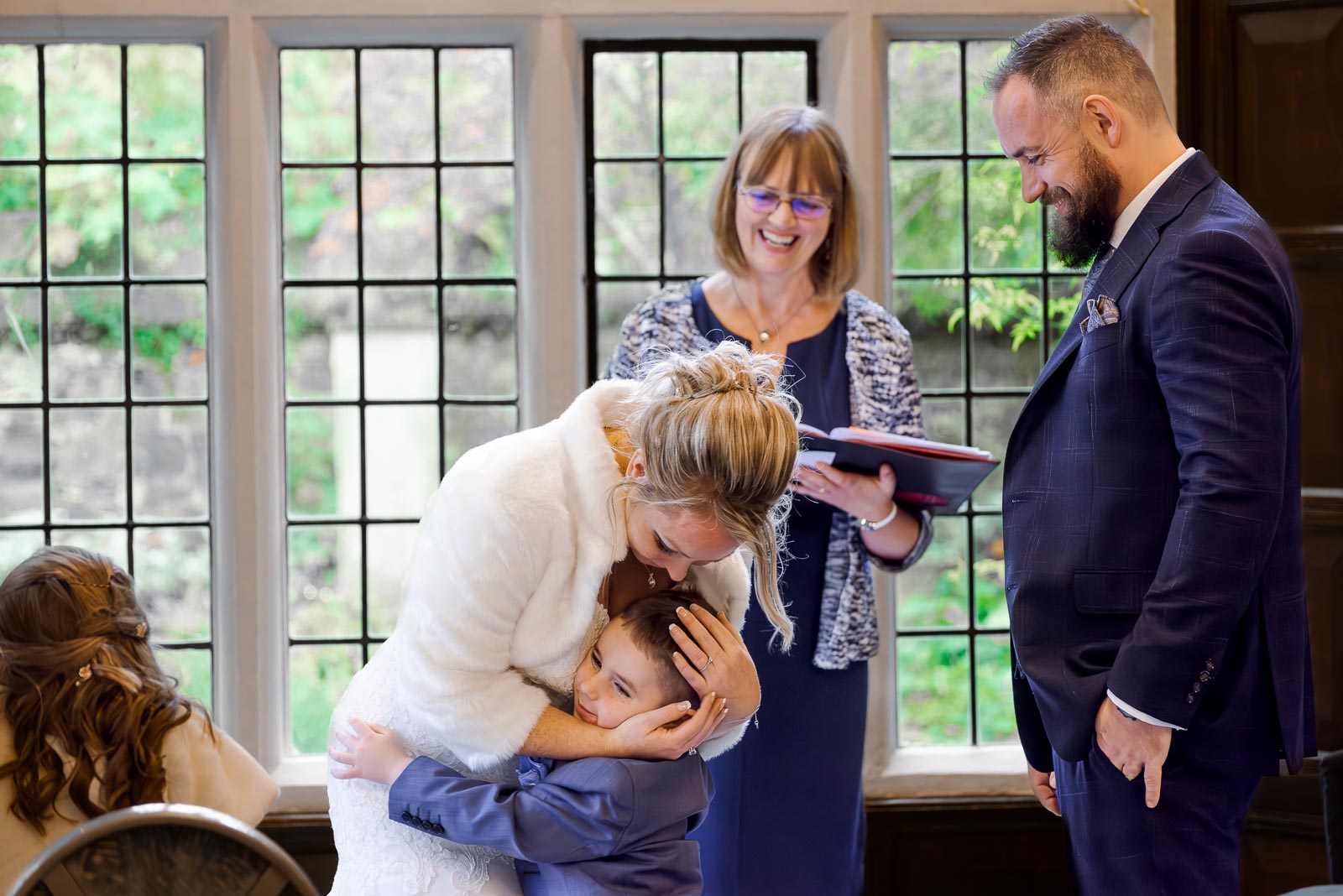 Laura embraces her son at the top of the aisle in the Ainsworth Room in Lewes Register Office during her wedding to Sam.