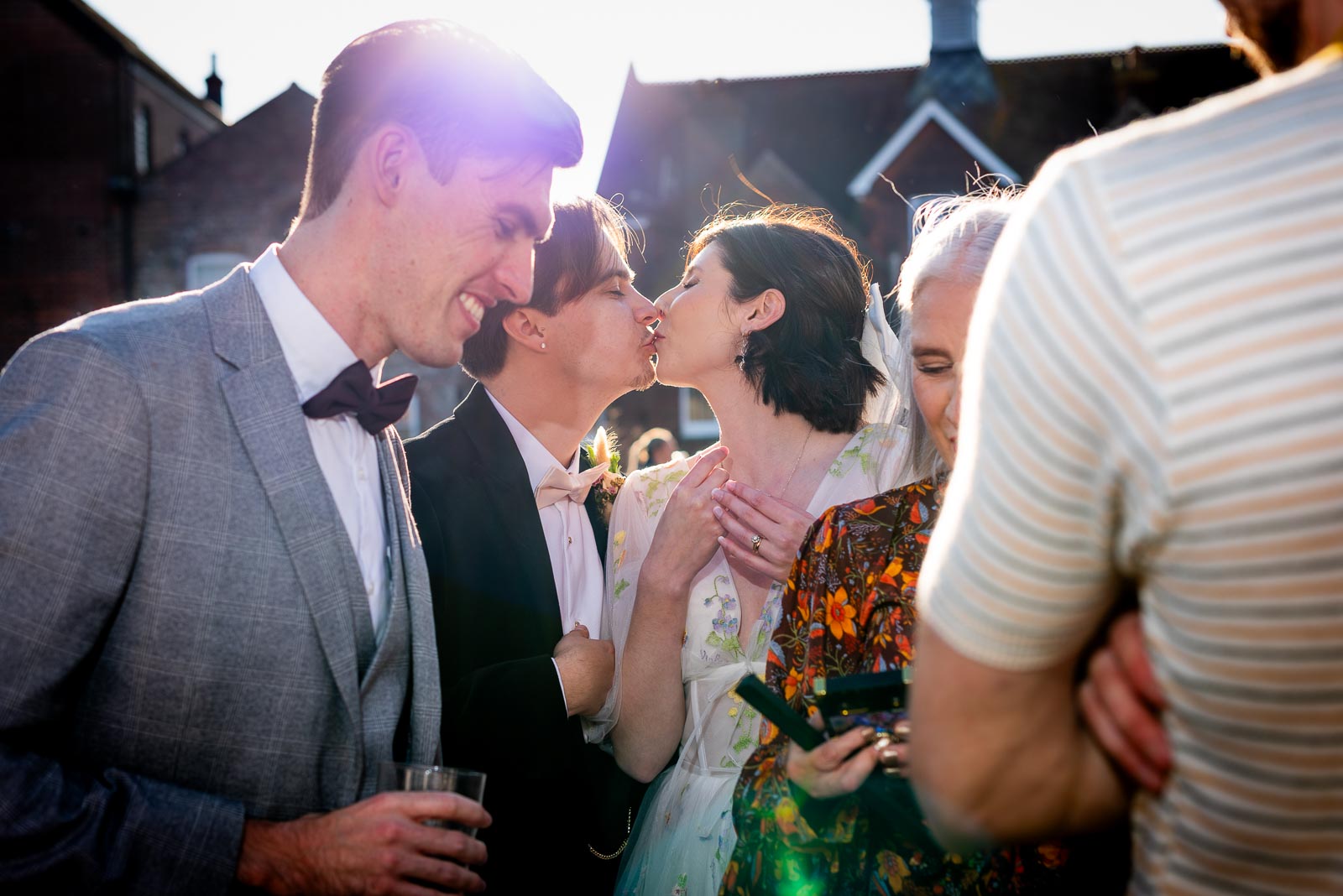 Lola and Laurence kiss outside John Harvey Tavern in Lewes at their wedding reception.