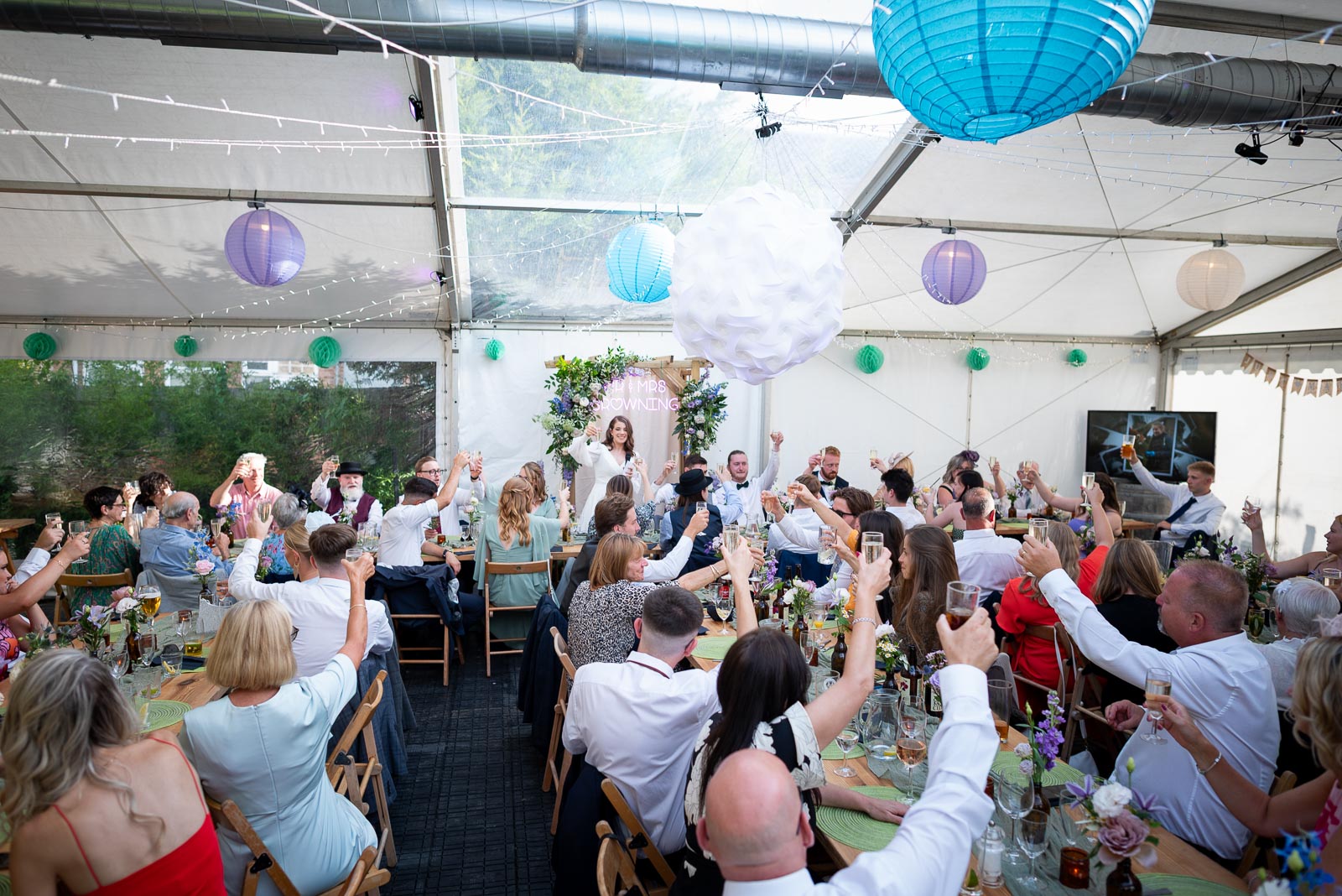 May makes a toast at the Wedding Breakfast in the garden of the Anchor Inn in Ringmer.