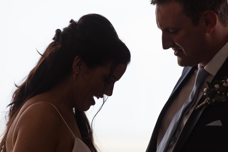 Ally and Jane smile at their wedding in The View Hotel, Eastbourne.
